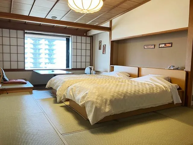 Bedroom, Bed in Yunokawa Kanko Hotel Shoen