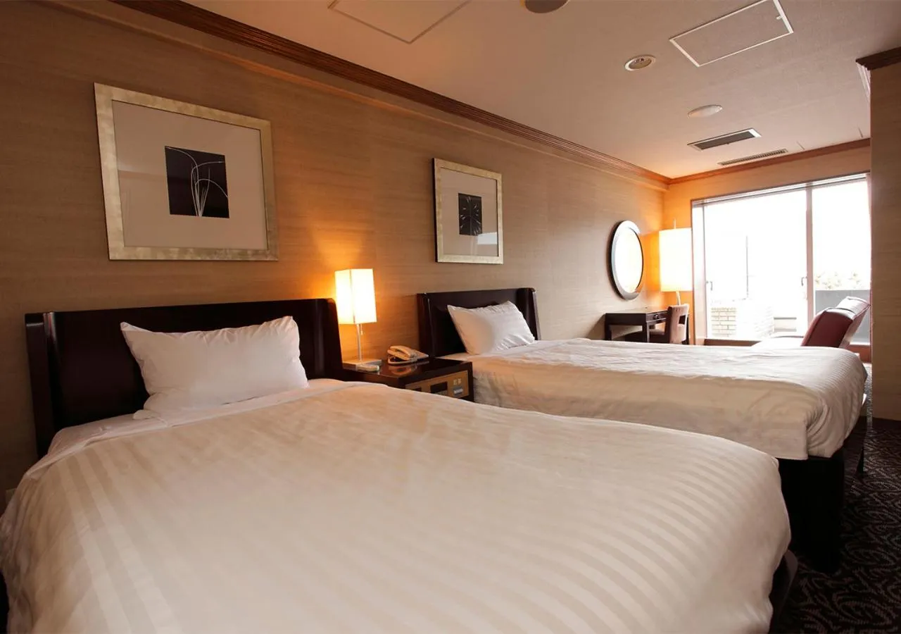 Bed in Atami Season Hotel