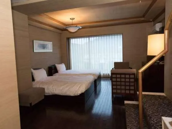 Bed in Atami Season Hotel