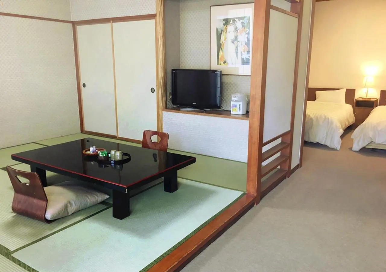 Photo of the whole room, Bed in Itoen Hotel New Sakura