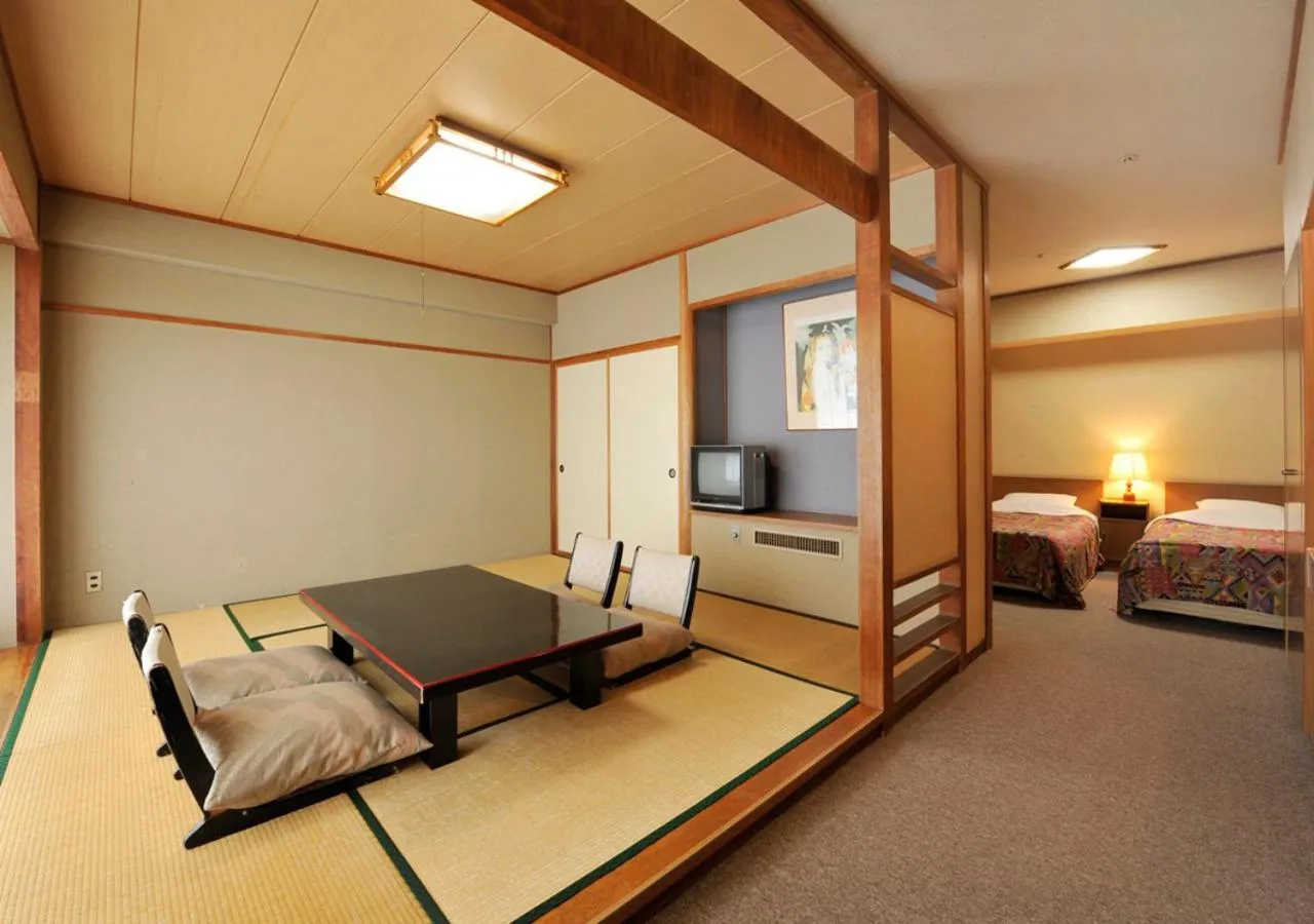 Photo of the whole room, Bed in Itoen Hotel New Sakura