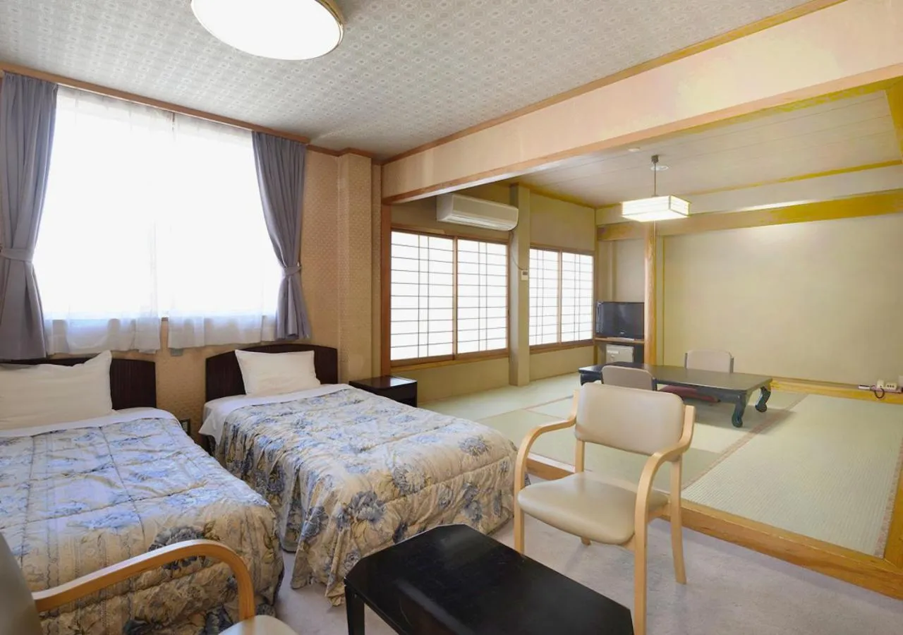 Photo of the whole room, Bed in Itoen Hotel New Sakura