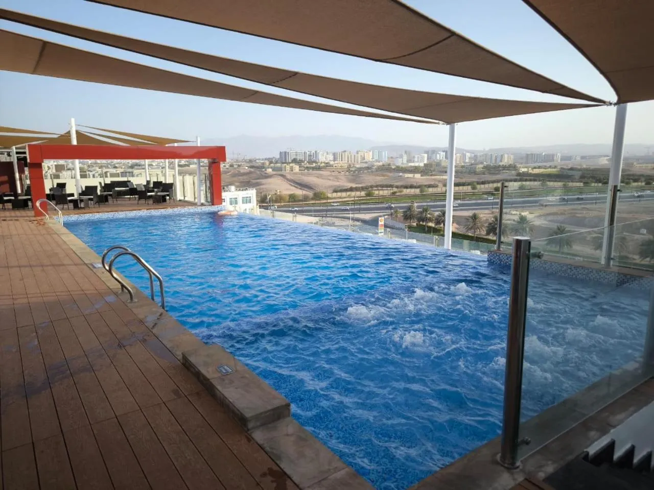 Swimming pool in Carnelian Muscat - Airport Hotel