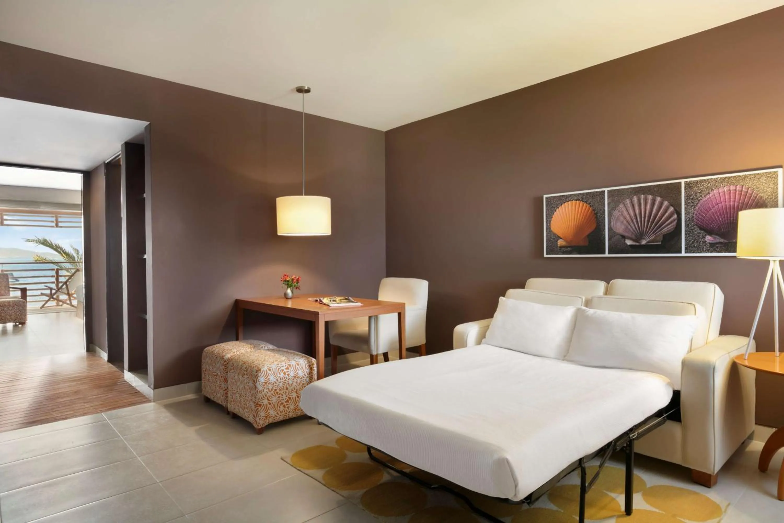 Living room, Bed in The Legend Paracas Resort, a Destination by Hyatt Hotel