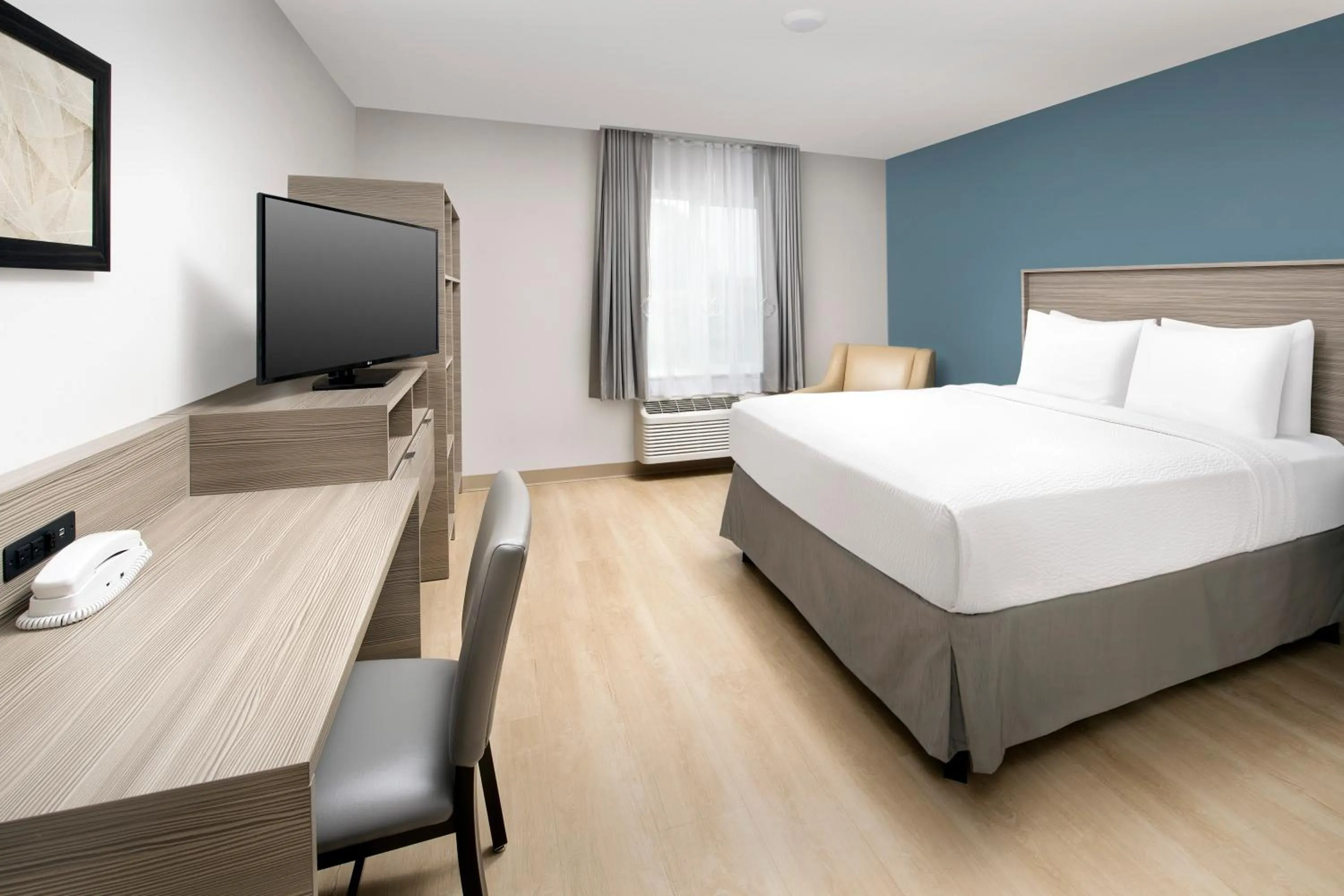 Photo of the whole room, Bed in WoodSpring Suites Seattle Redmond