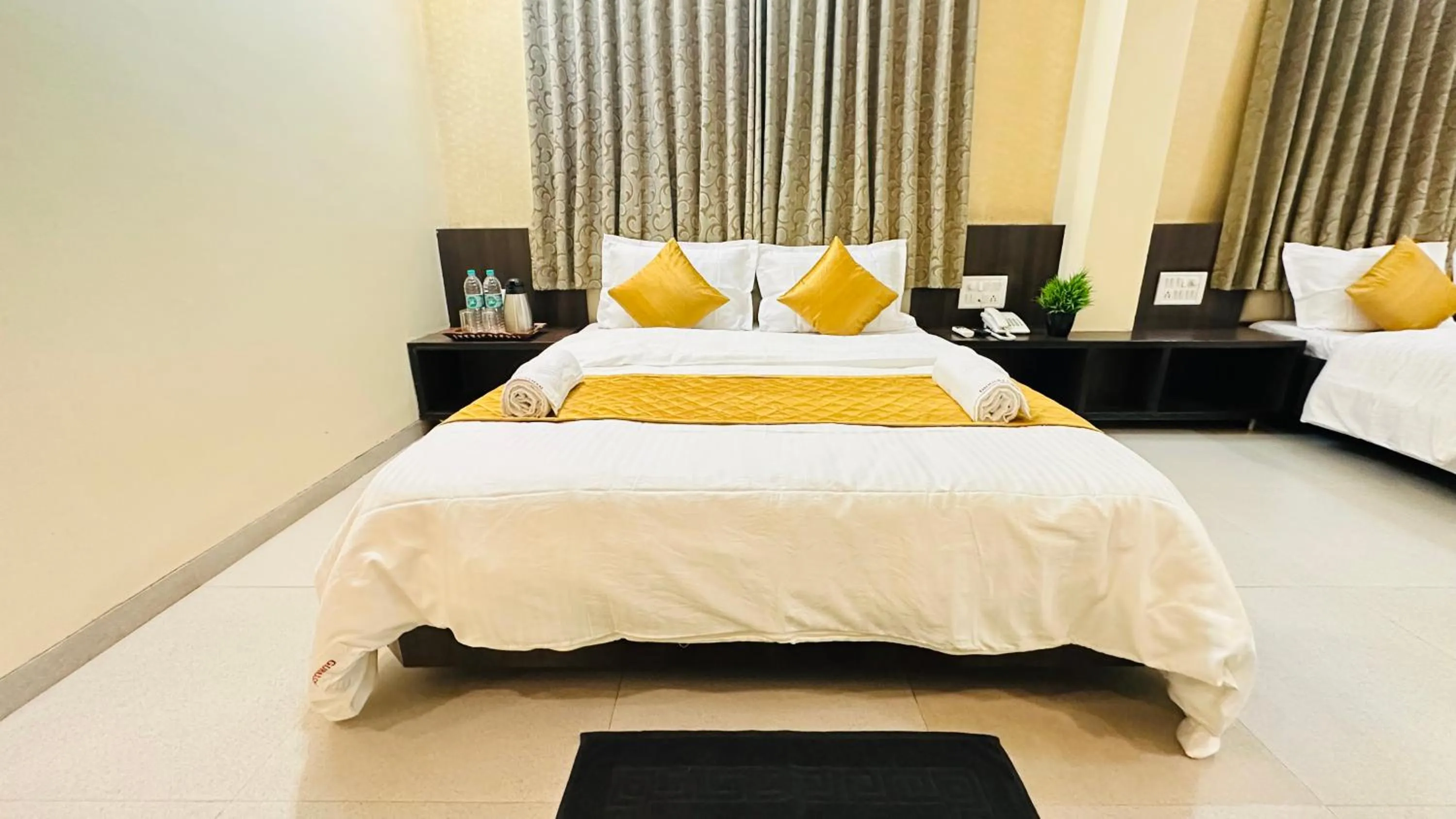 Bed in Hotel Sai Gurusthan