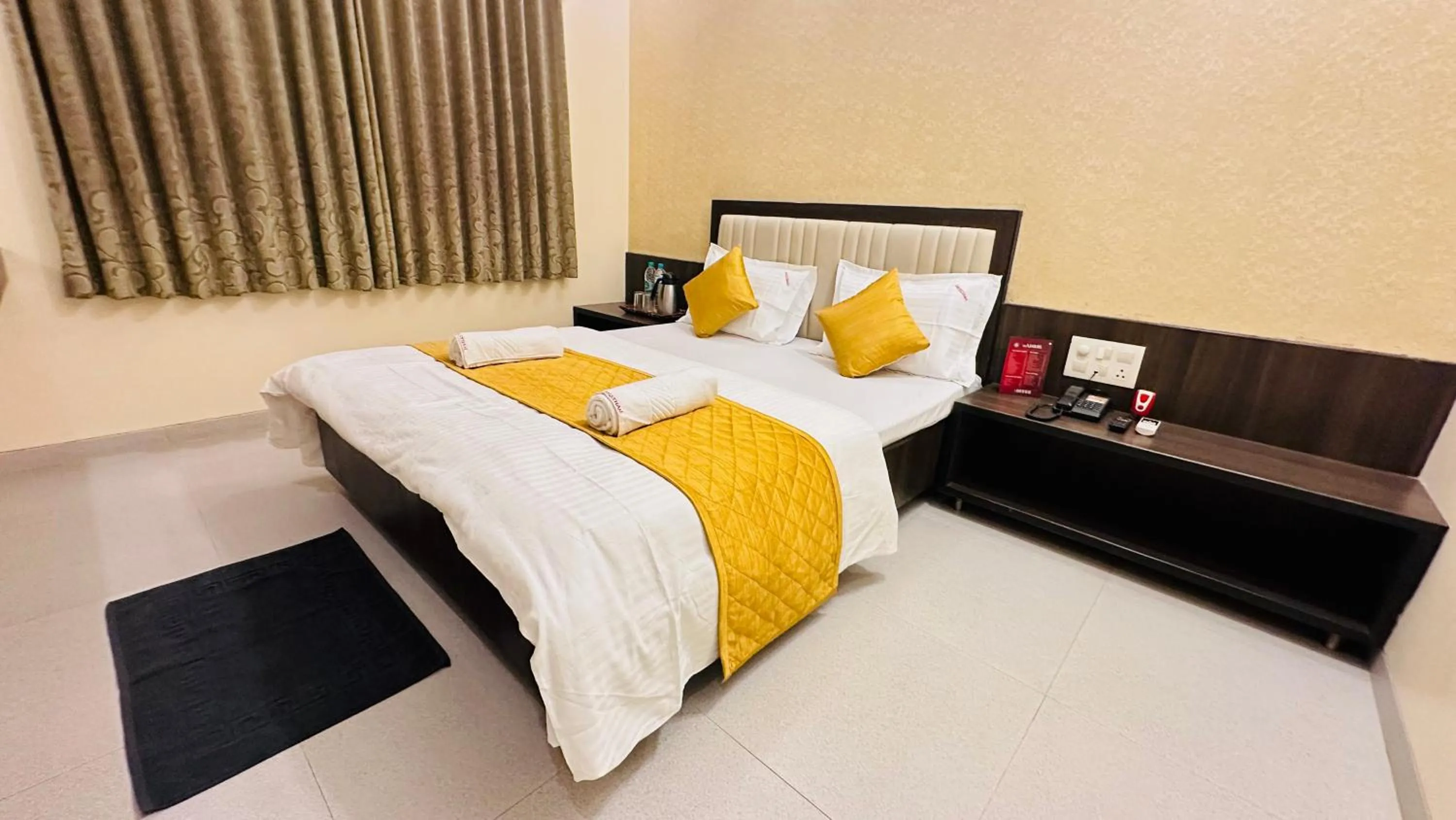 Bed in Hotel Sai Gurusthan