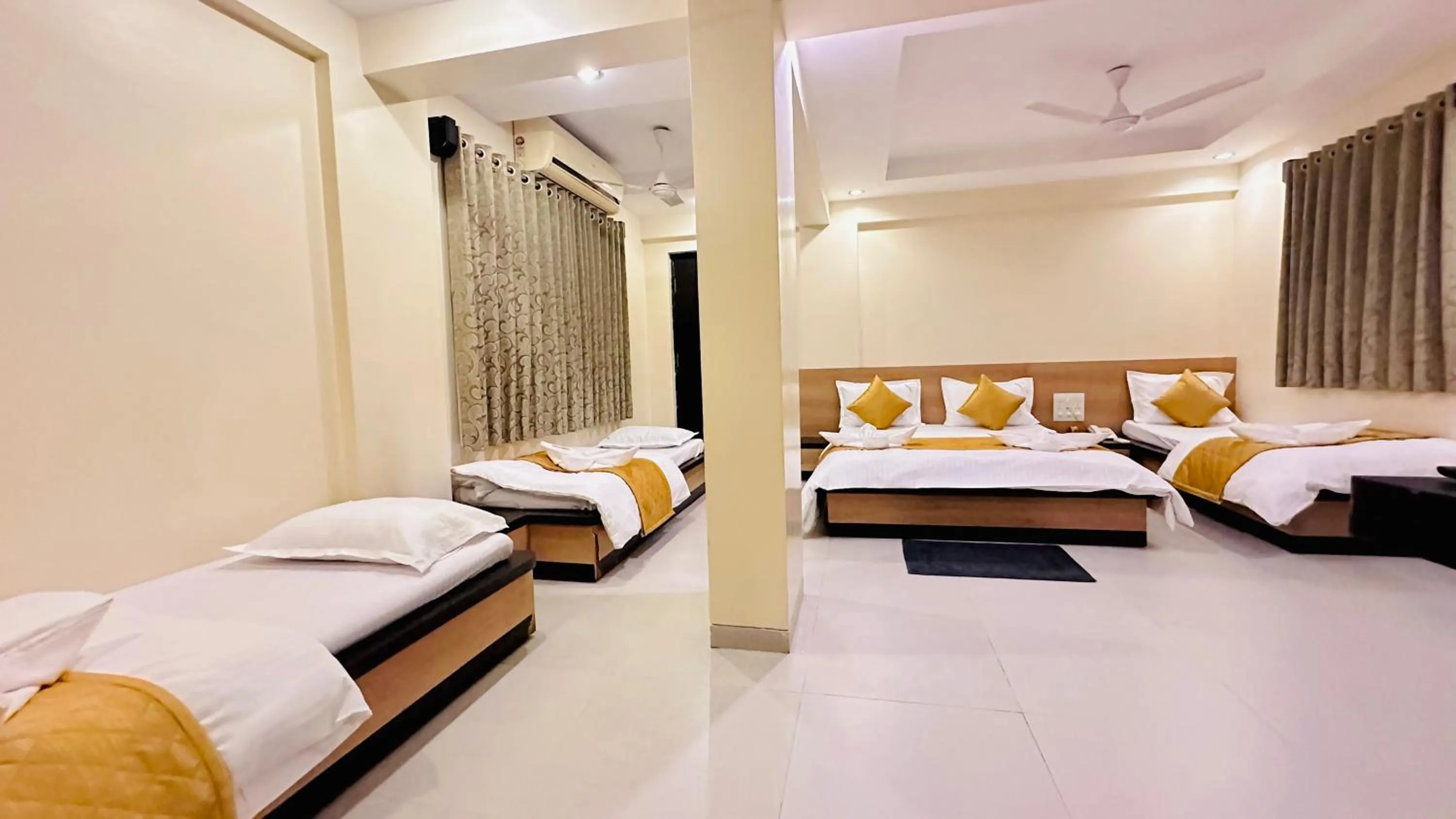 Bed in Hotel Sai Gurusthan