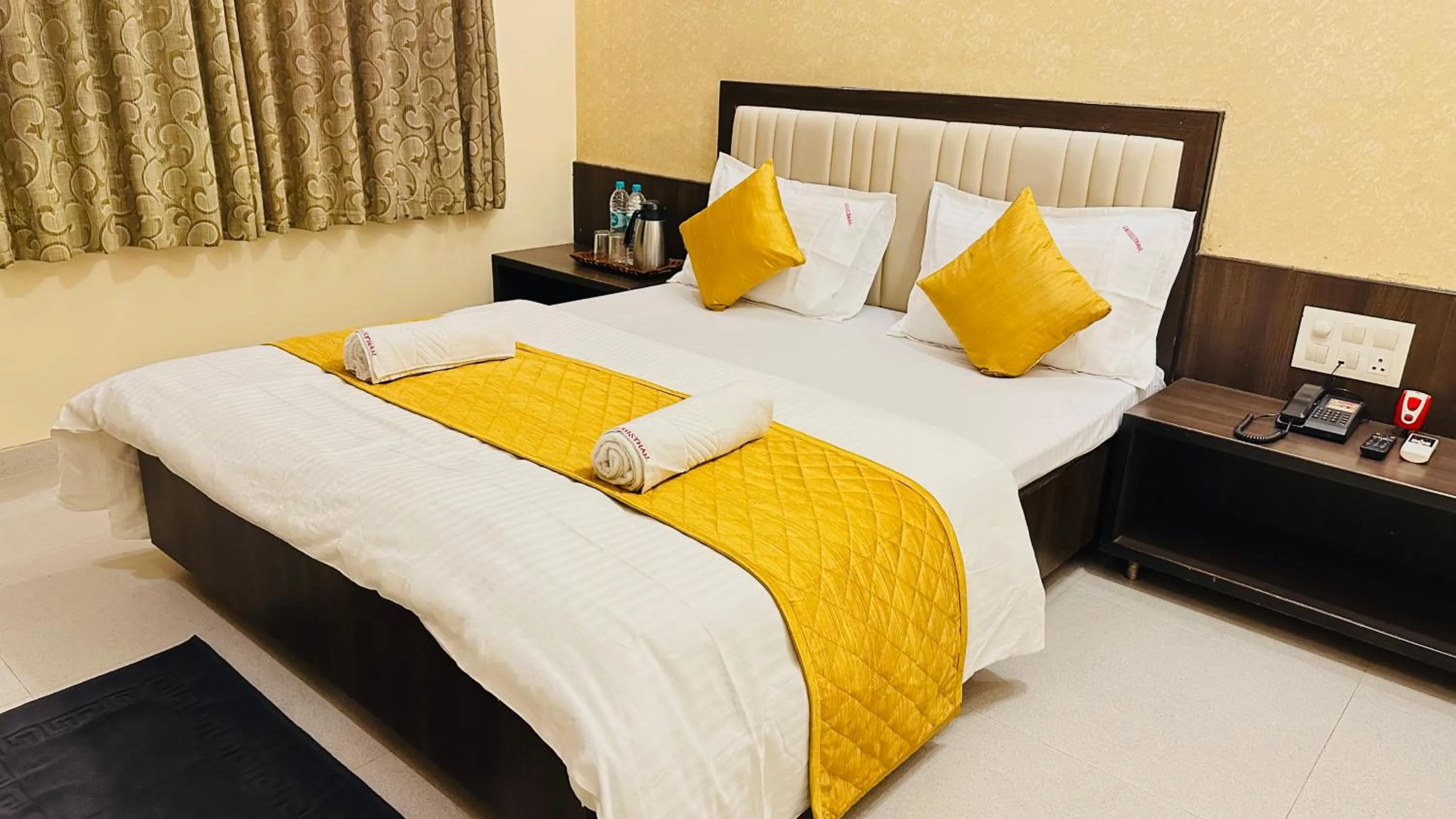 Bed in Hotel Sai Gurusthan