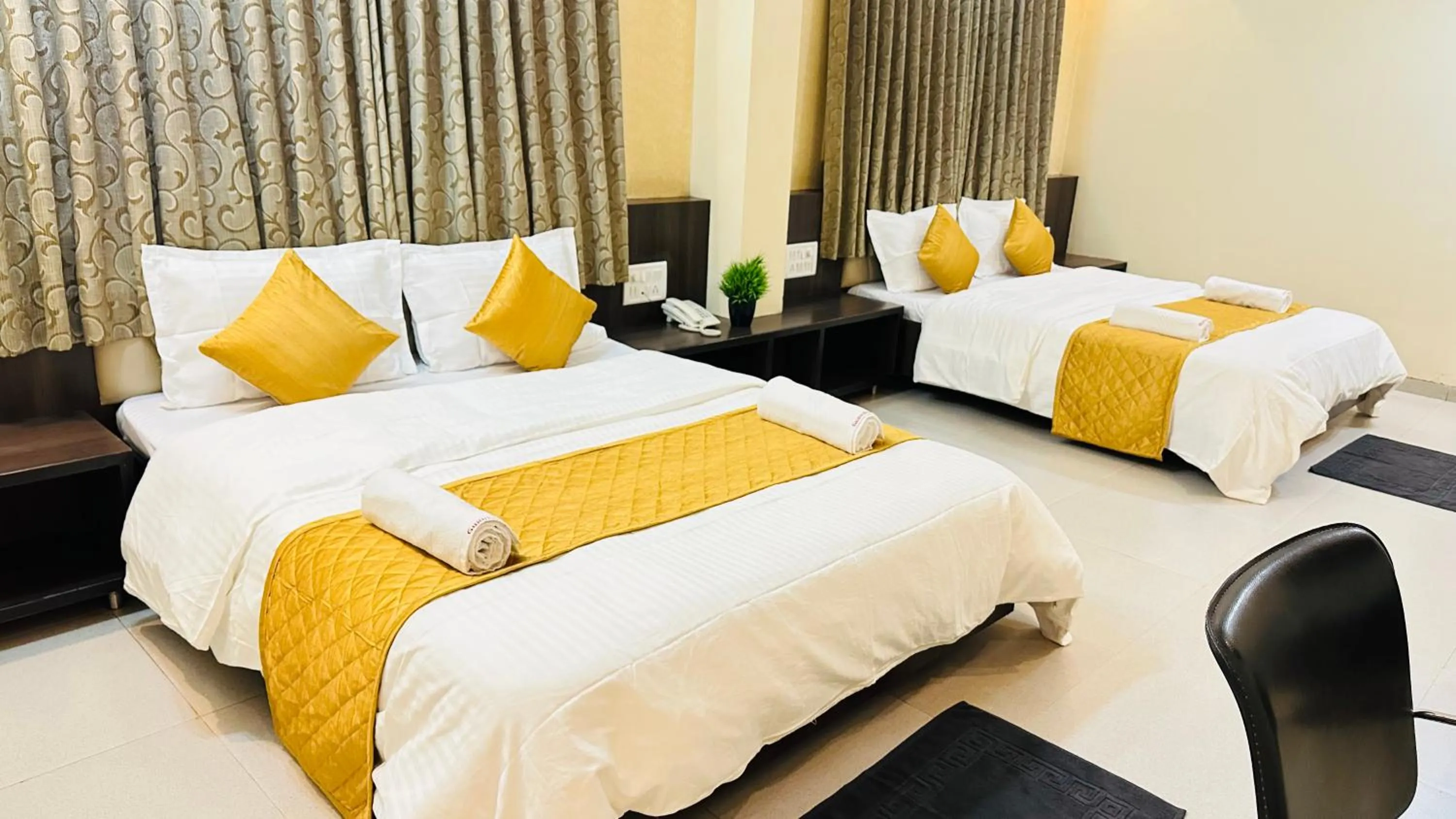 Bed in Hotel Sai Gurusthan