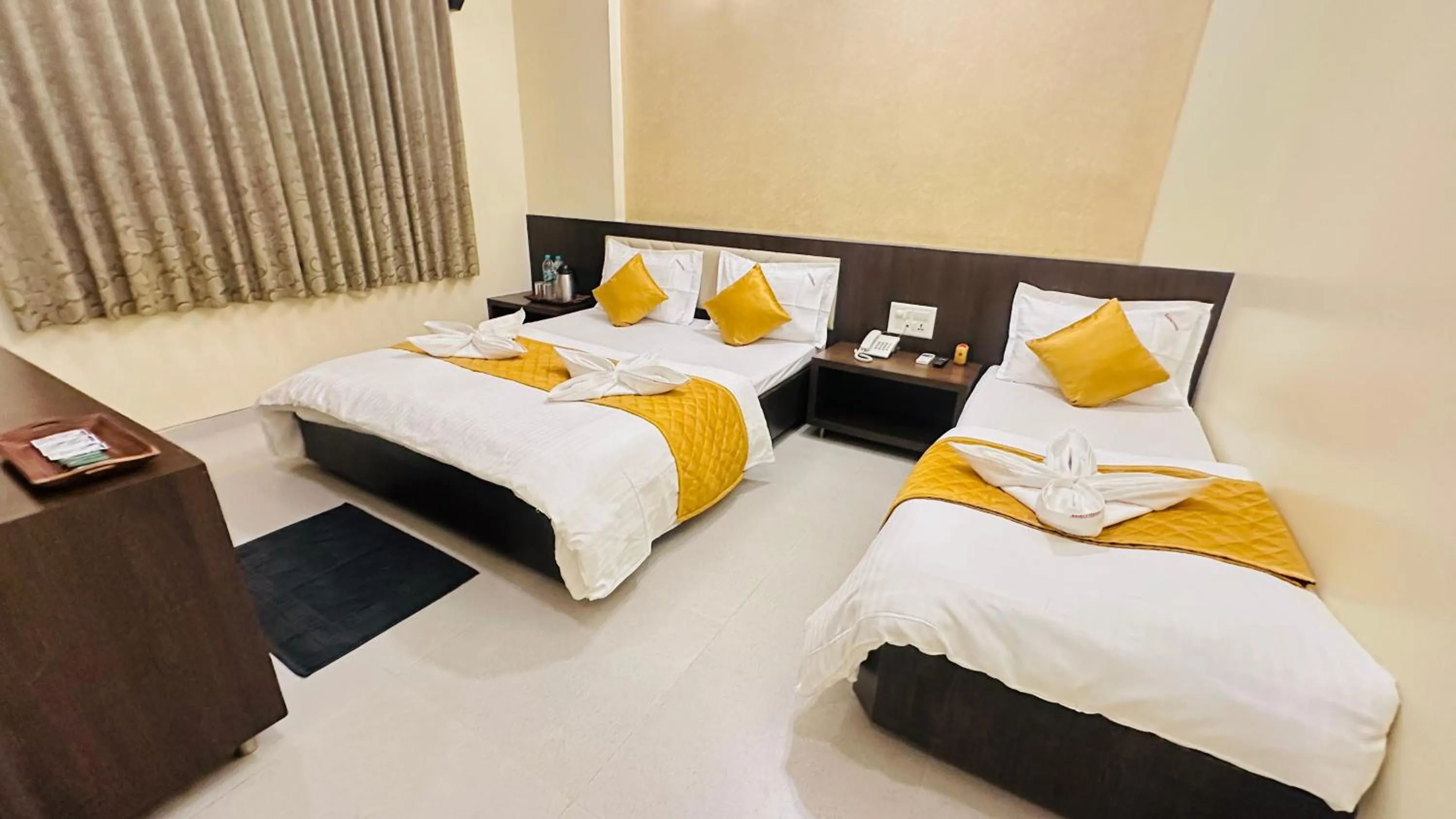 Bed in Hotel Sai Gurusthan