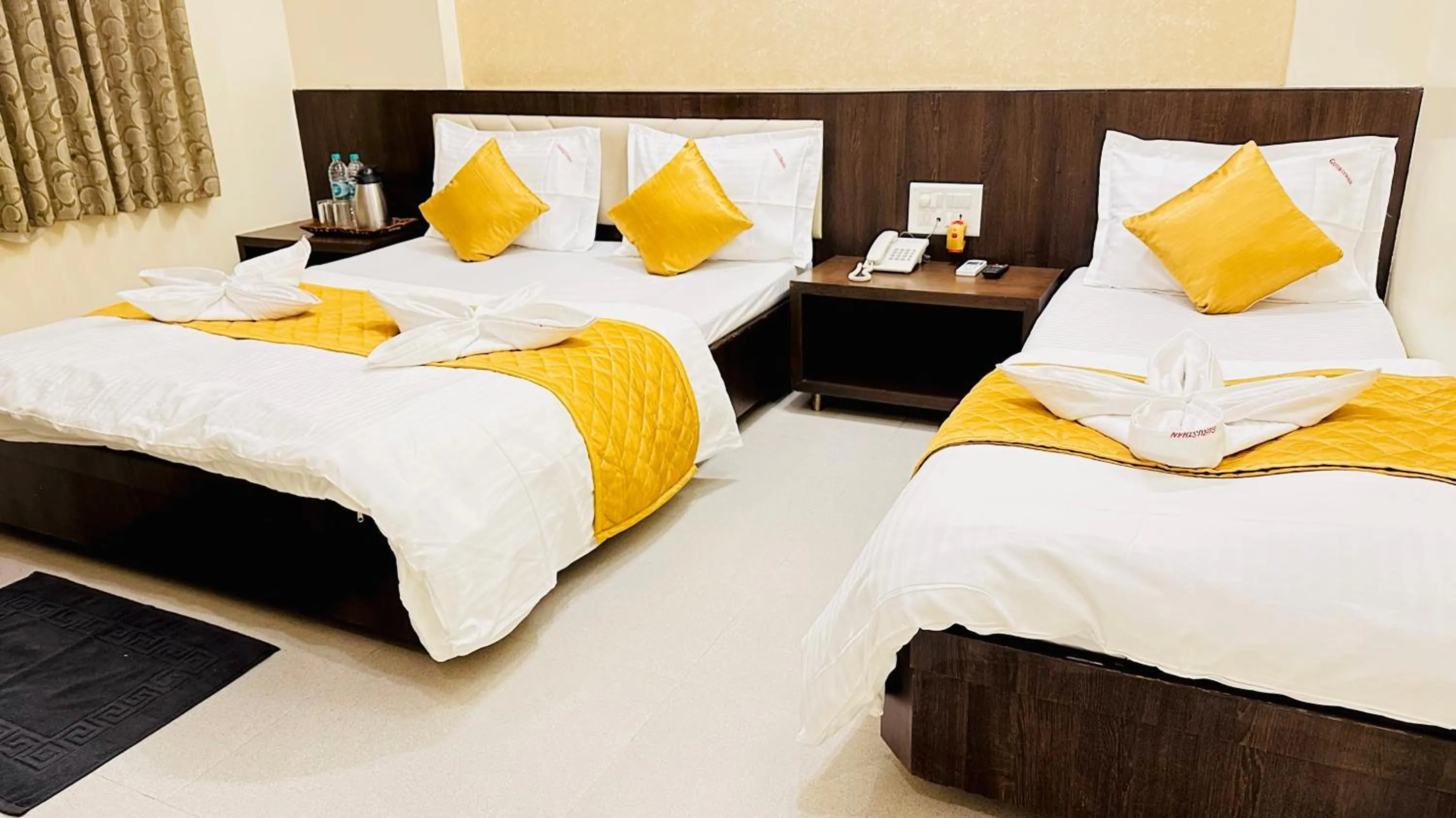 Bed in Hotel Sai Gurusthan