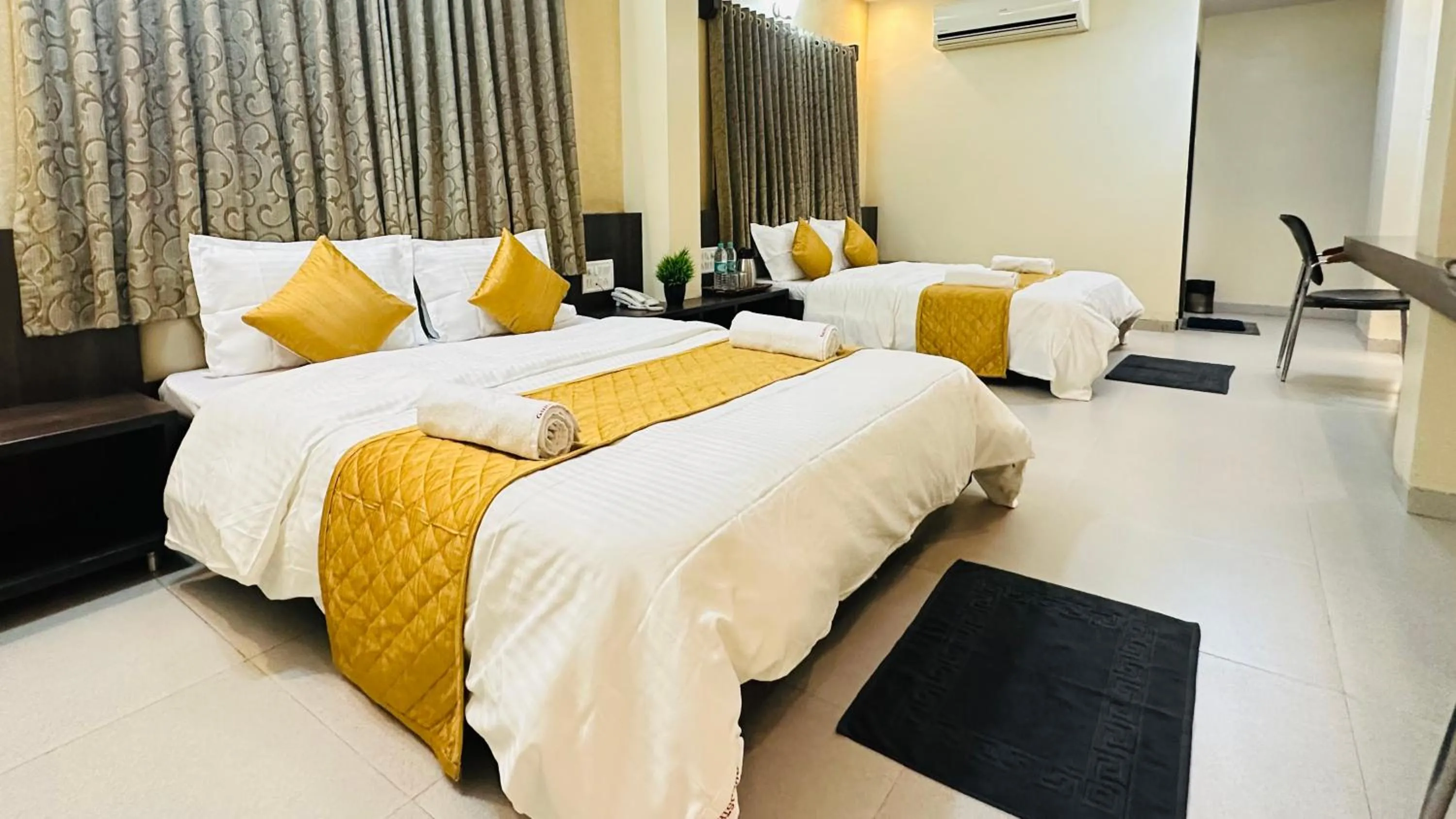 Bed in Hotel Sai Gurusthan