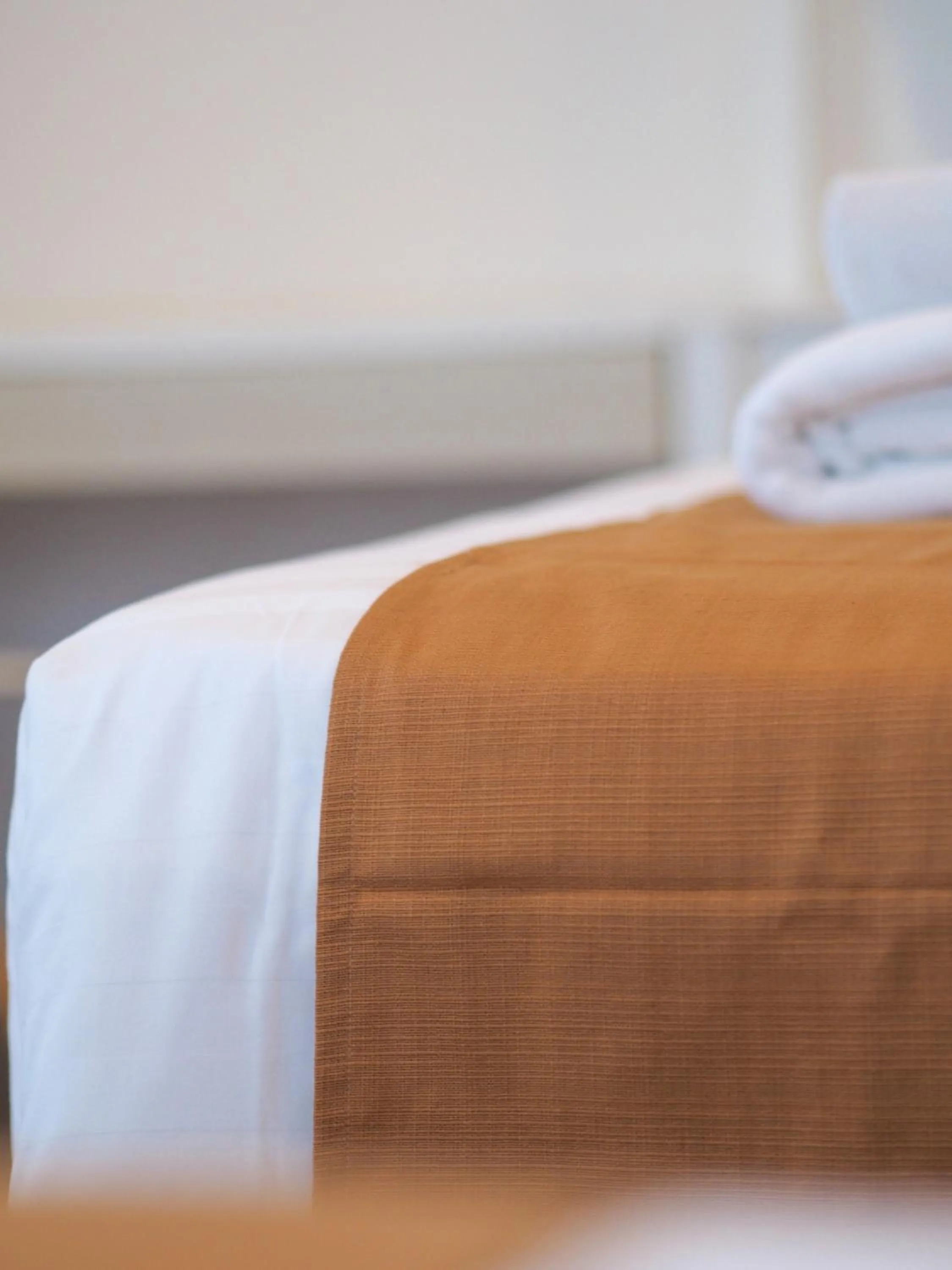 Bed in THE KANNAS Hotel & Serviced Apartment, Chiang Mai SHA Certified