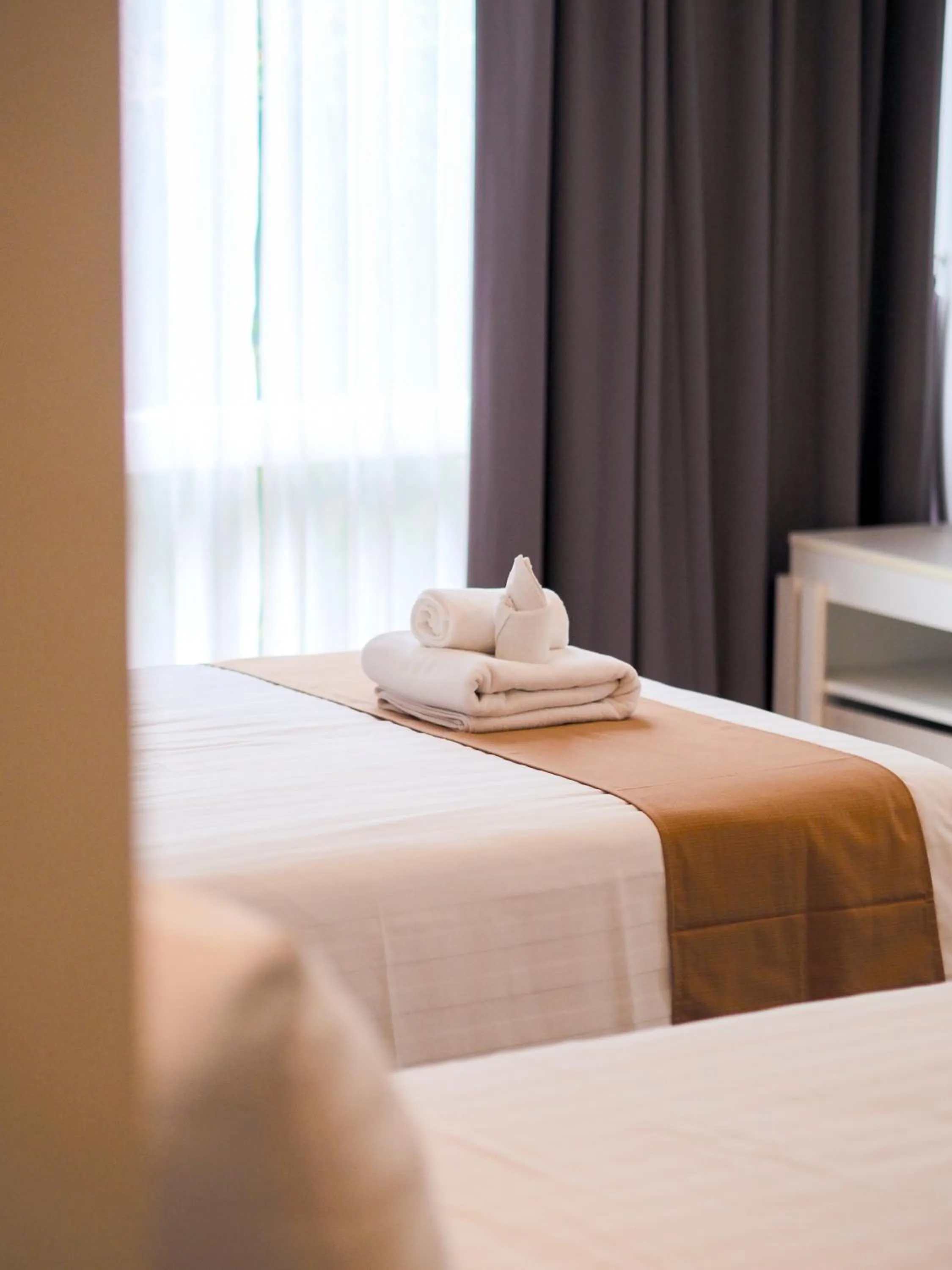 Bed in THE KANNAS Hotel & Serviced Apartment, Chiang Mai SHA Certified