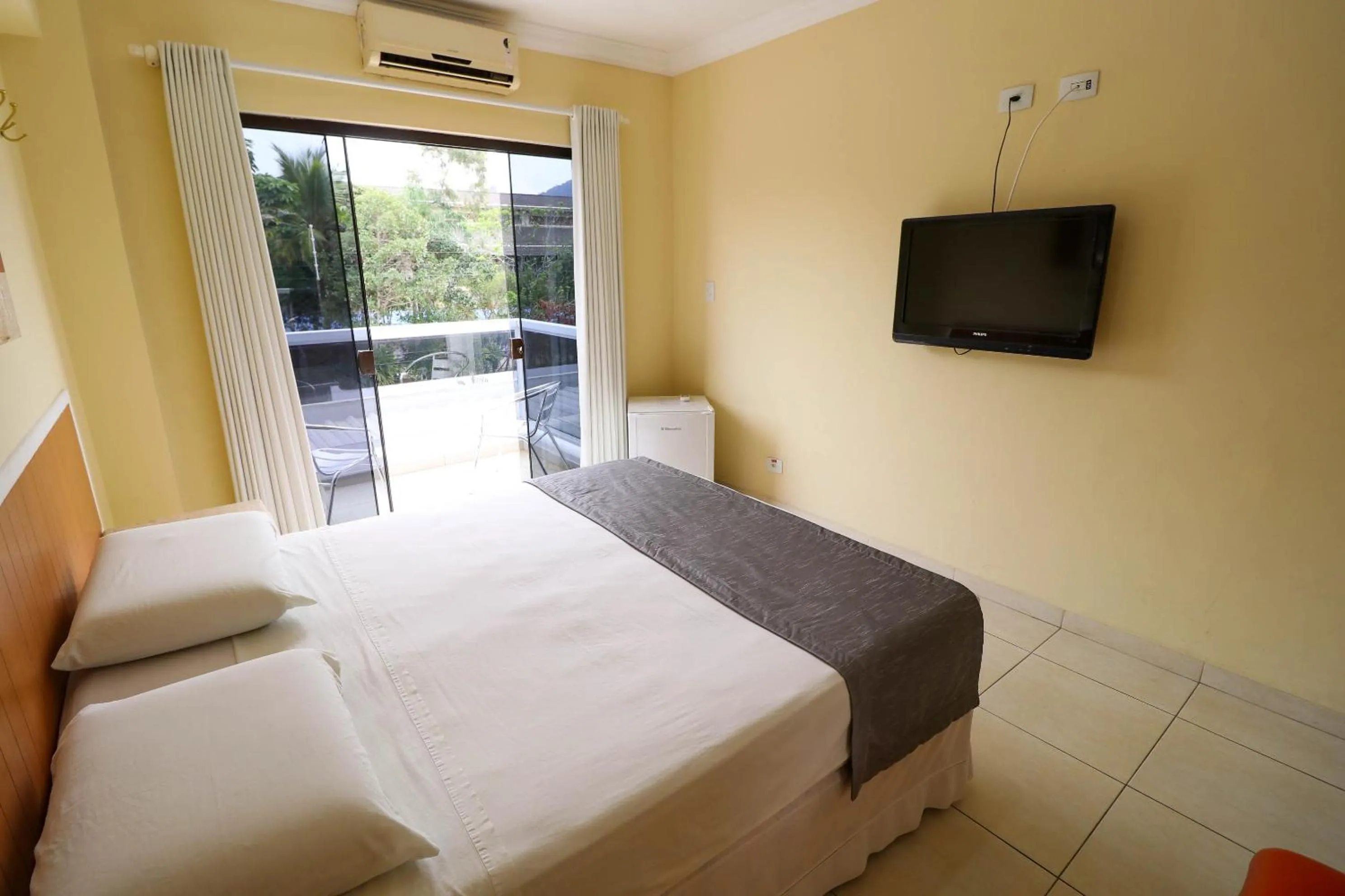 Bed in Charme Hotel Guarujá Frente Mar