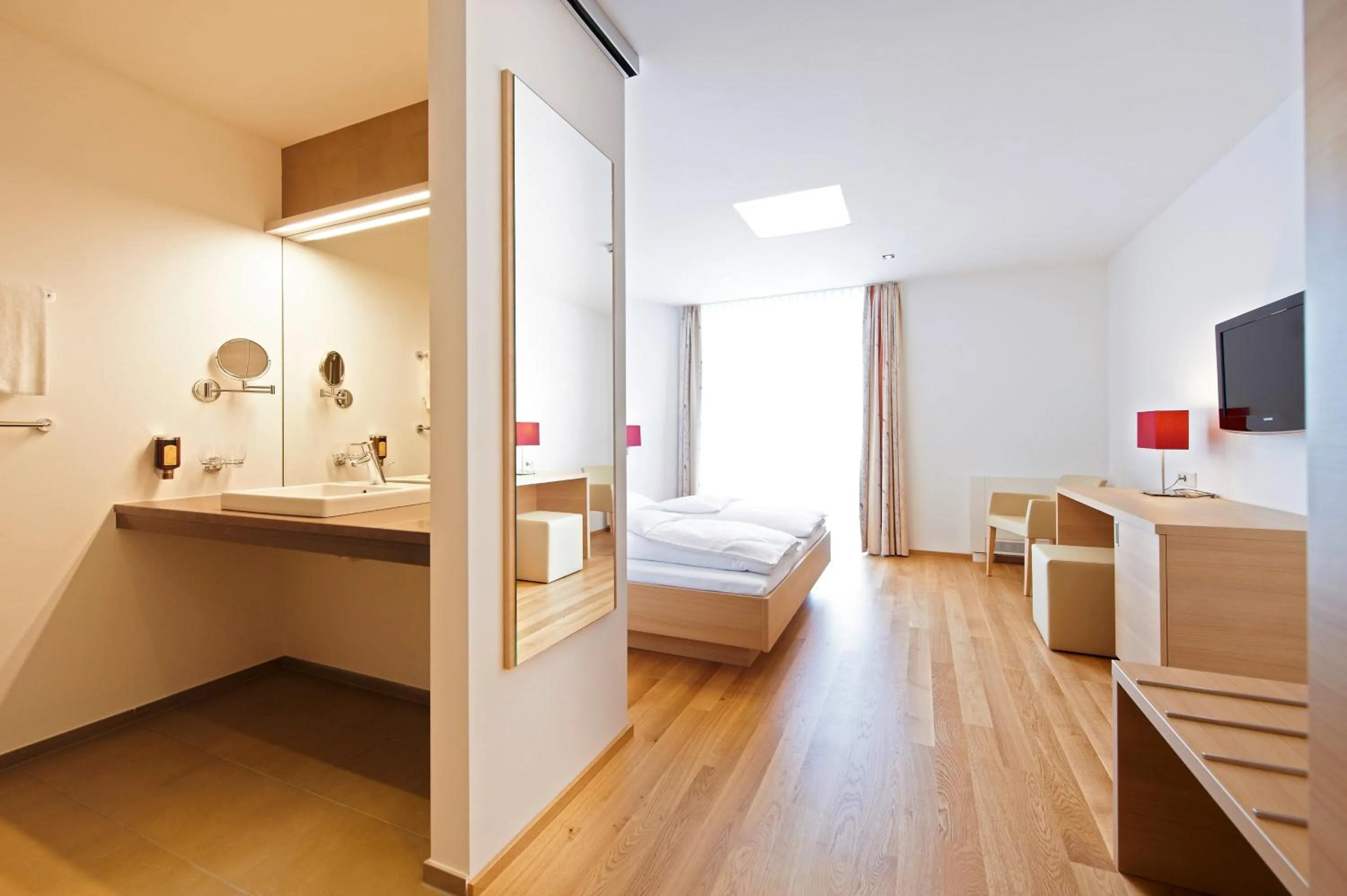 Bathroom, Bed in Sternen Hotel Wolfurt