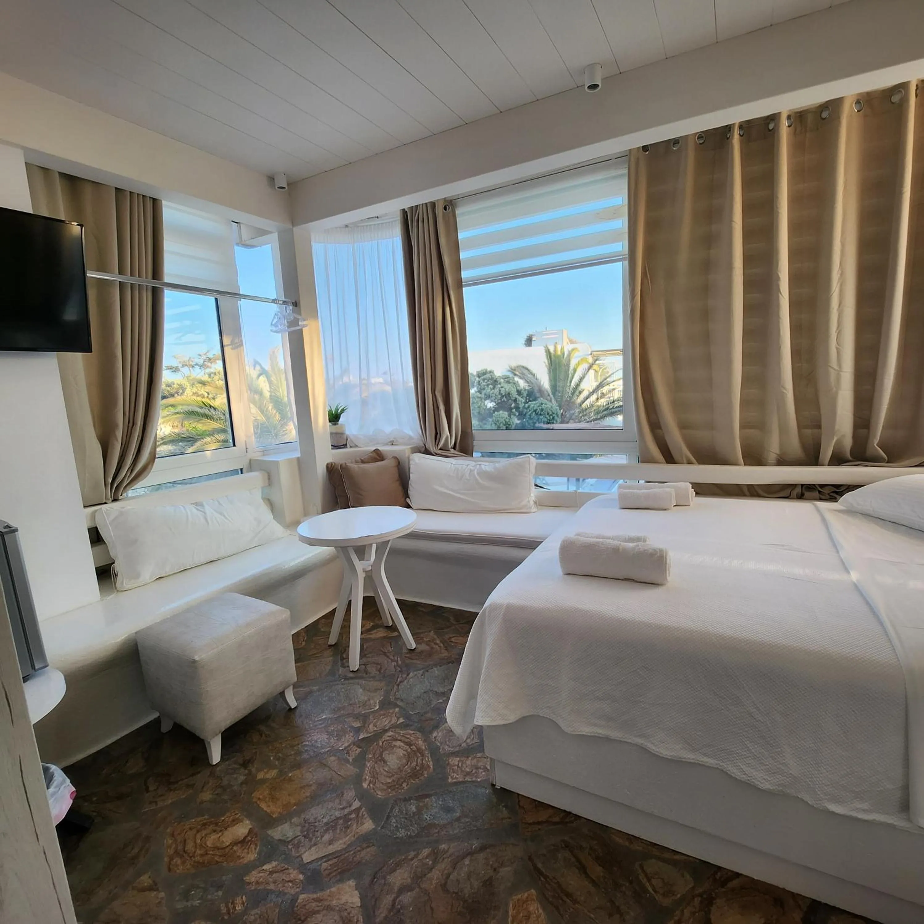 Bed in Mykonian Iros Suites & Villas