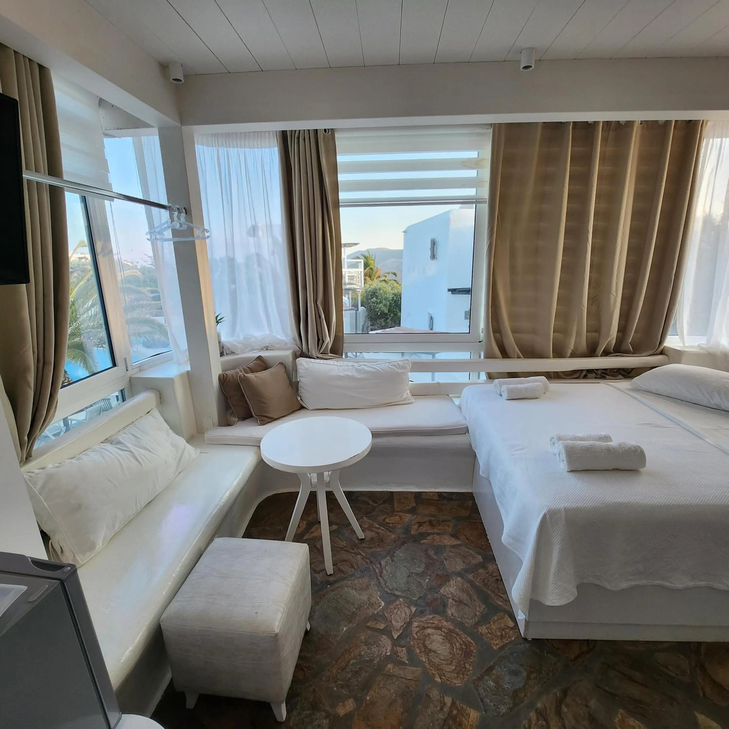 Bed in Mykonian Iros Suites & Villas