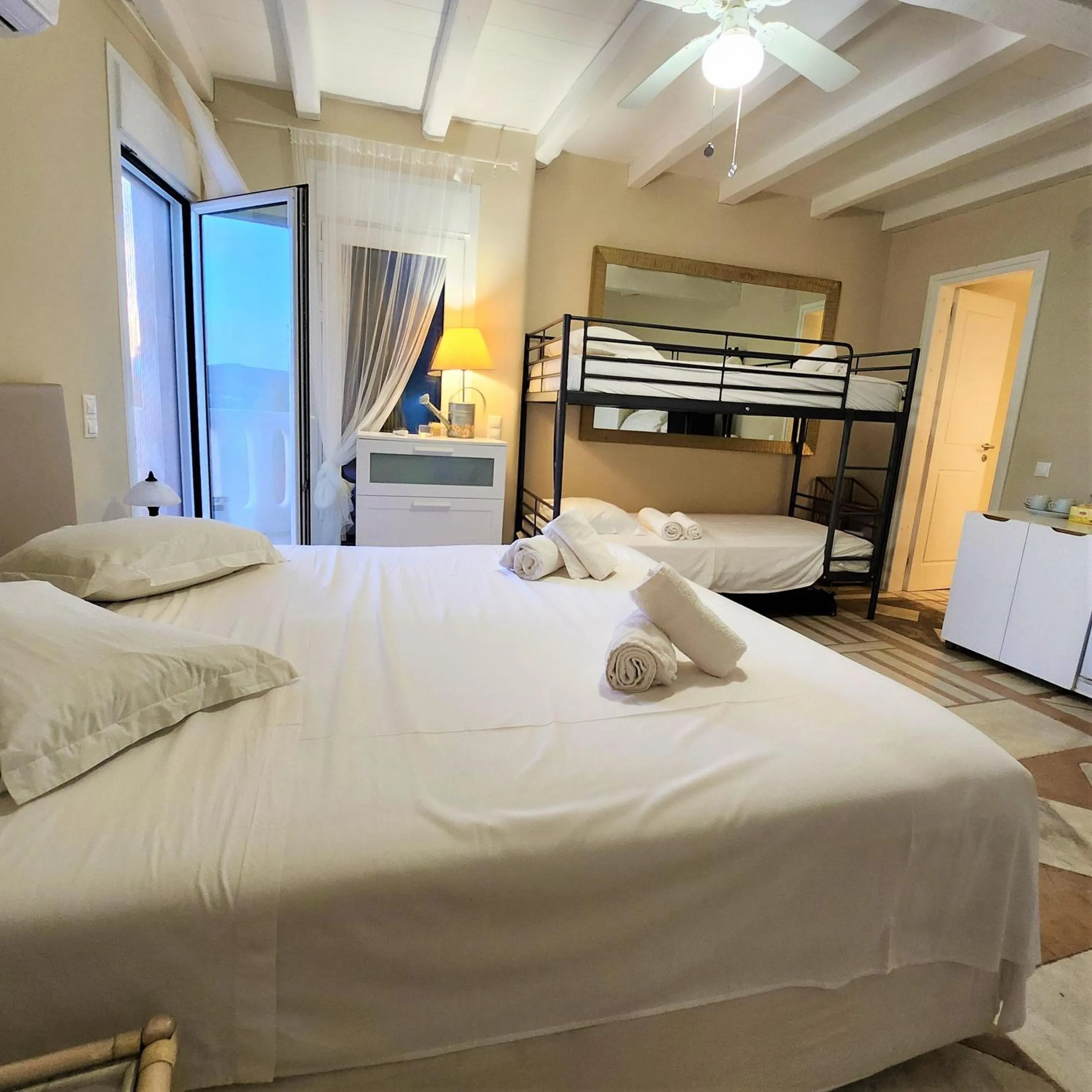 Bed in Mykonian Iros Suites & Villas