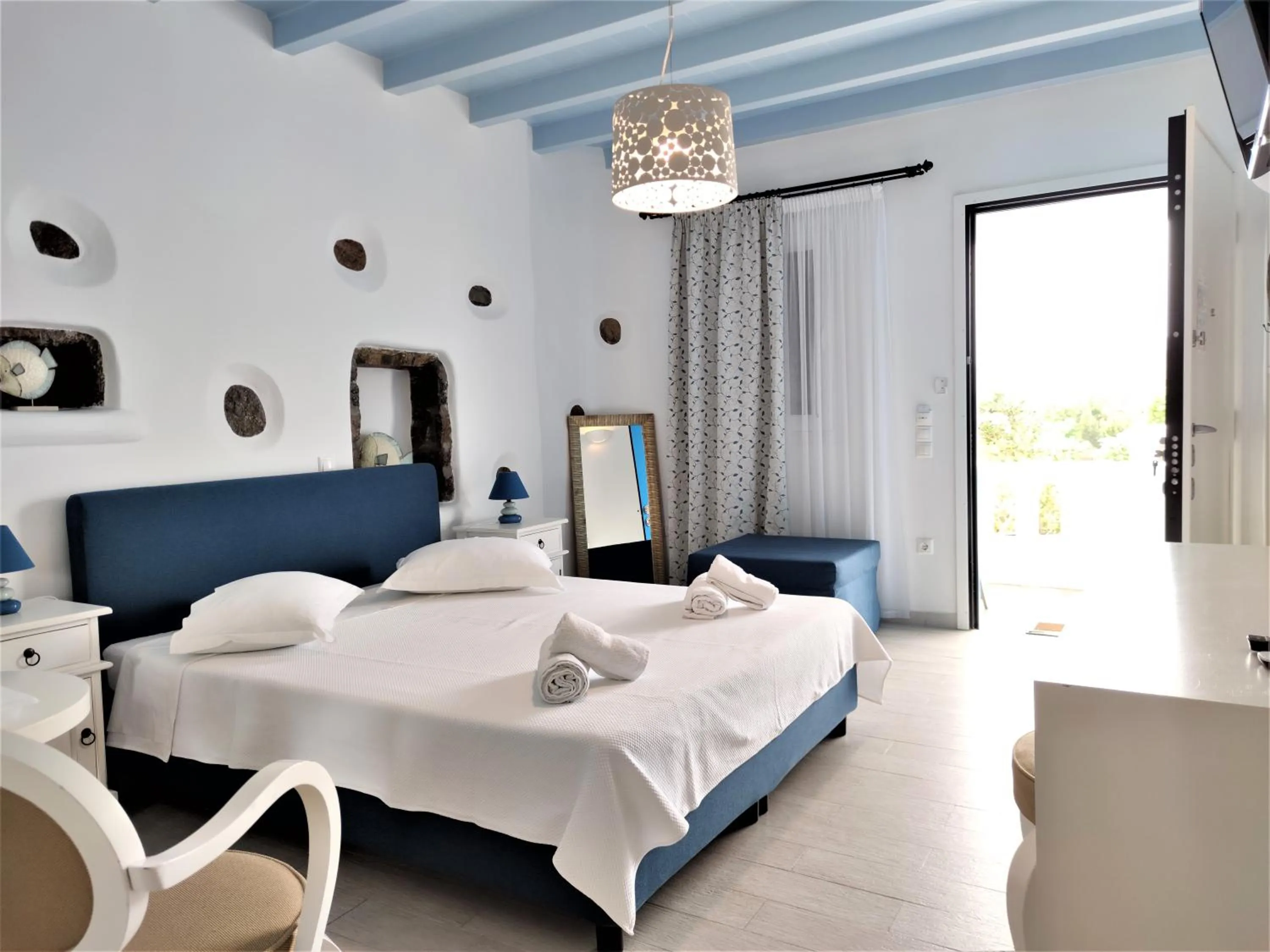 Bed in Mykonian Iros Suites & Villas