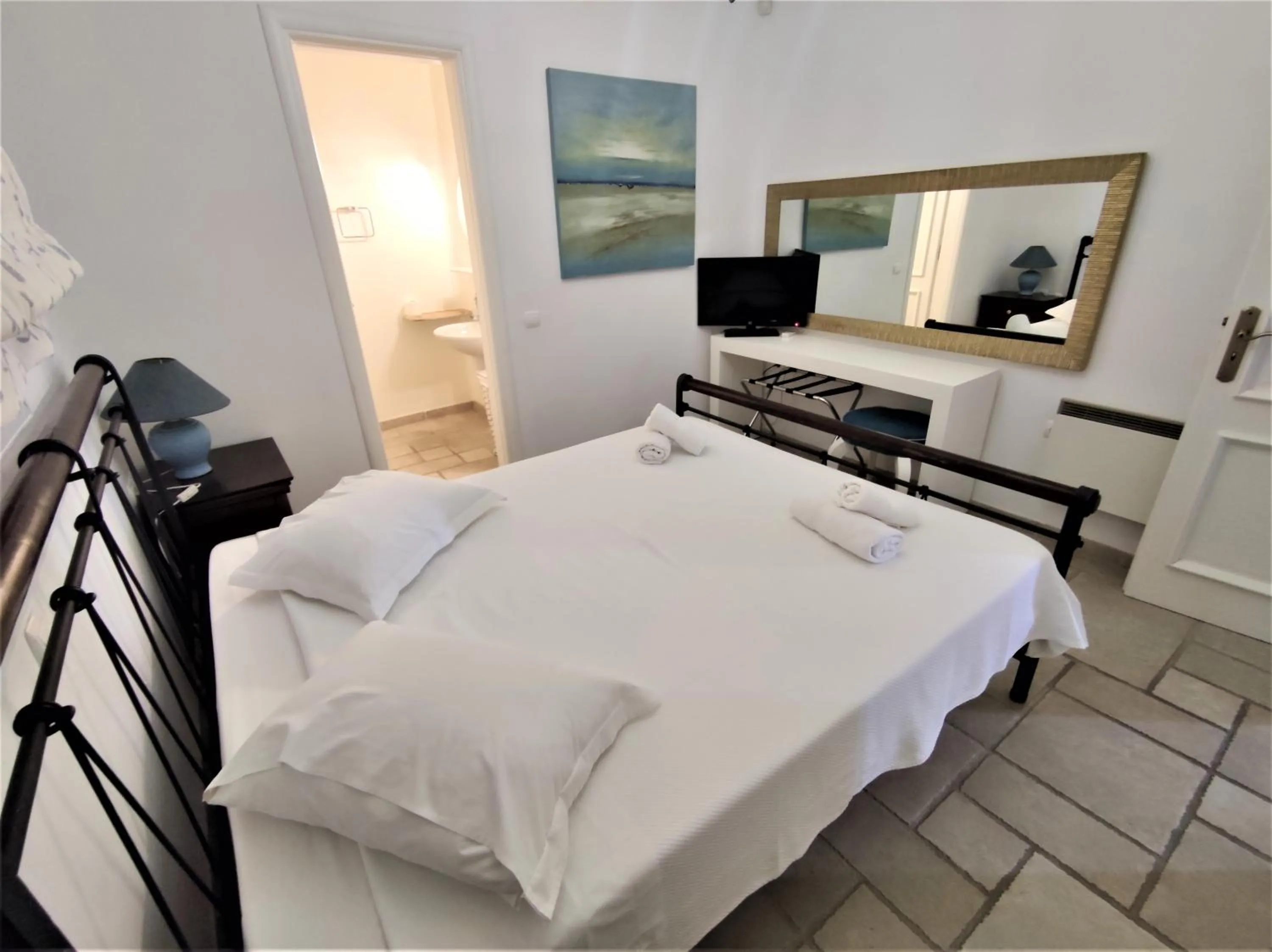 Bed in Mykonian Iros Suites & Villas
