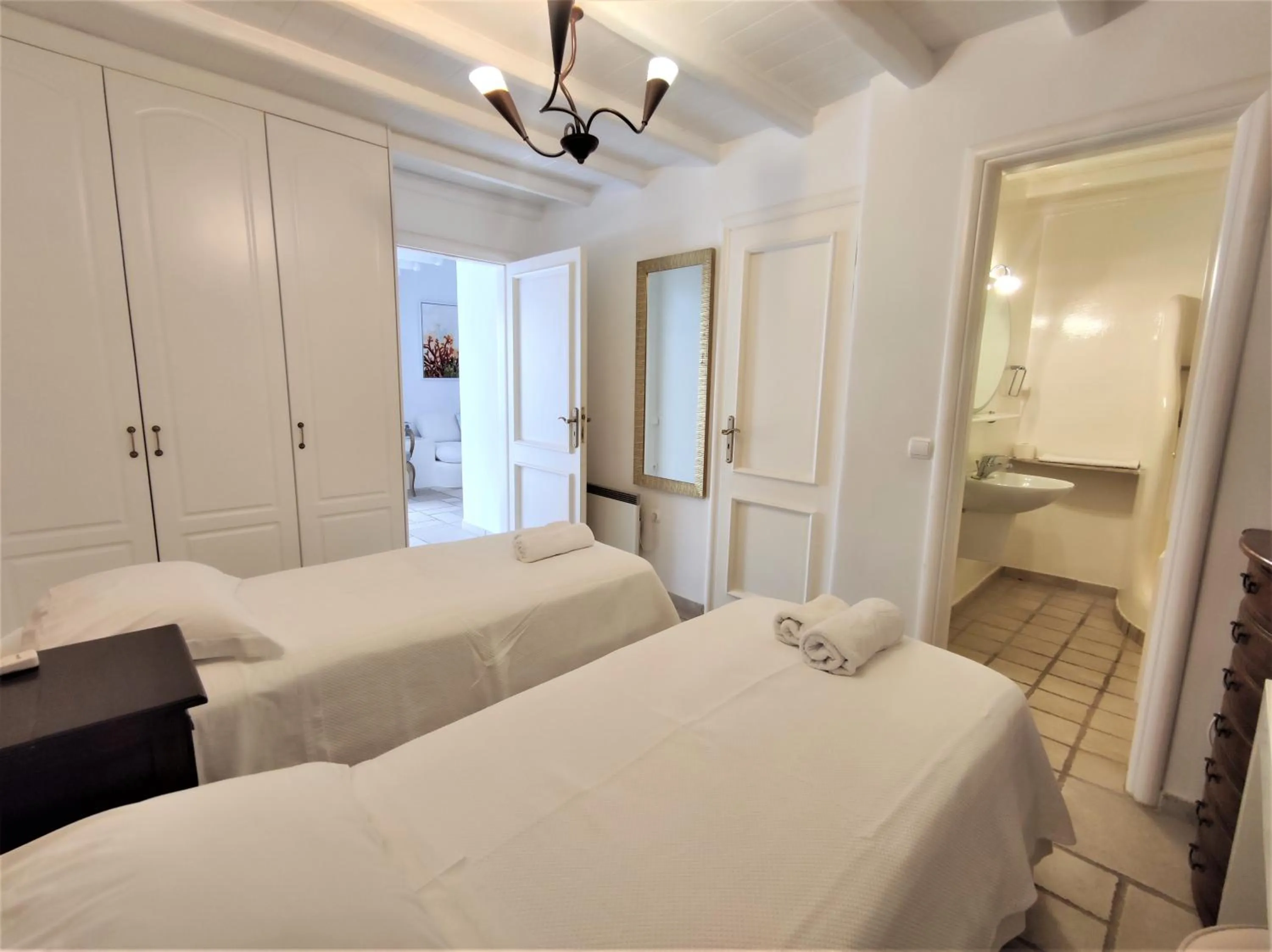 Bed in Mykonian Iros Suites & Villas