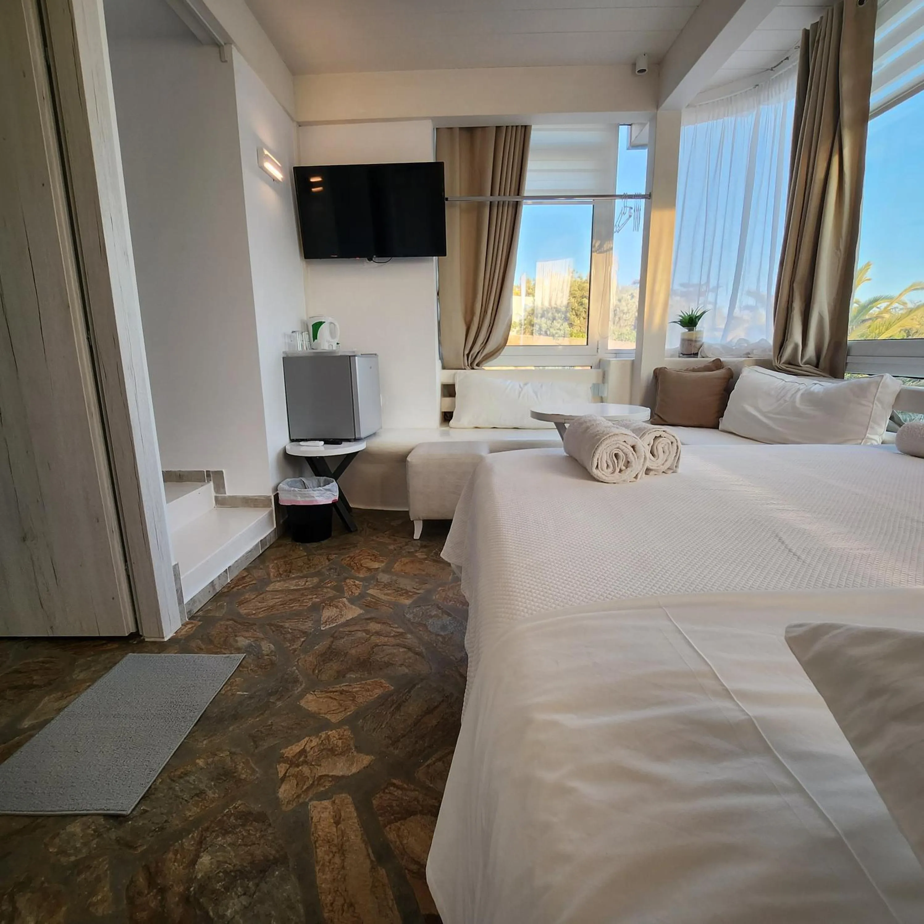 Bed in Mykonian Iros Suites & Villas