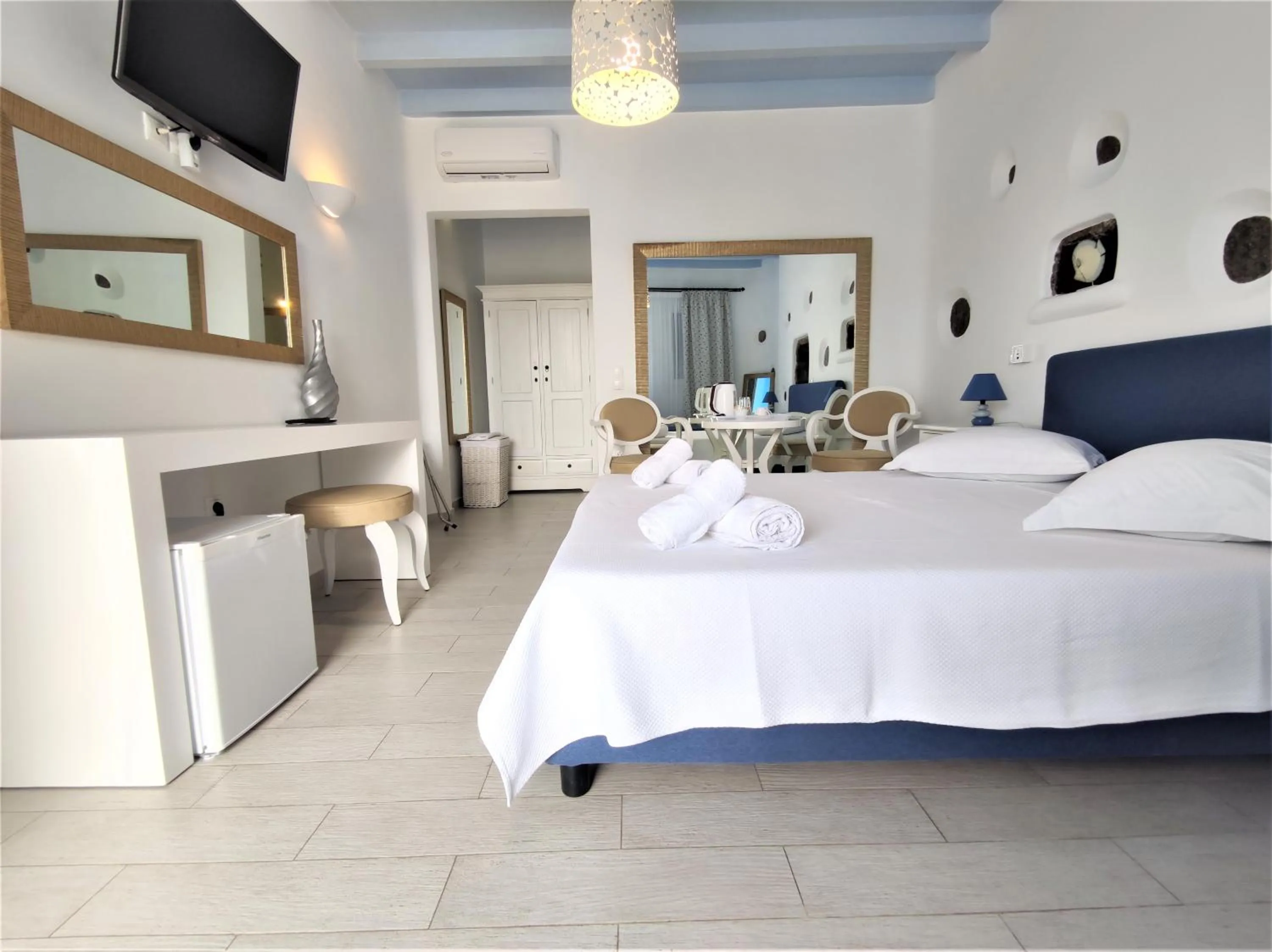 Bed in Mykonian Iros Suites & Villas