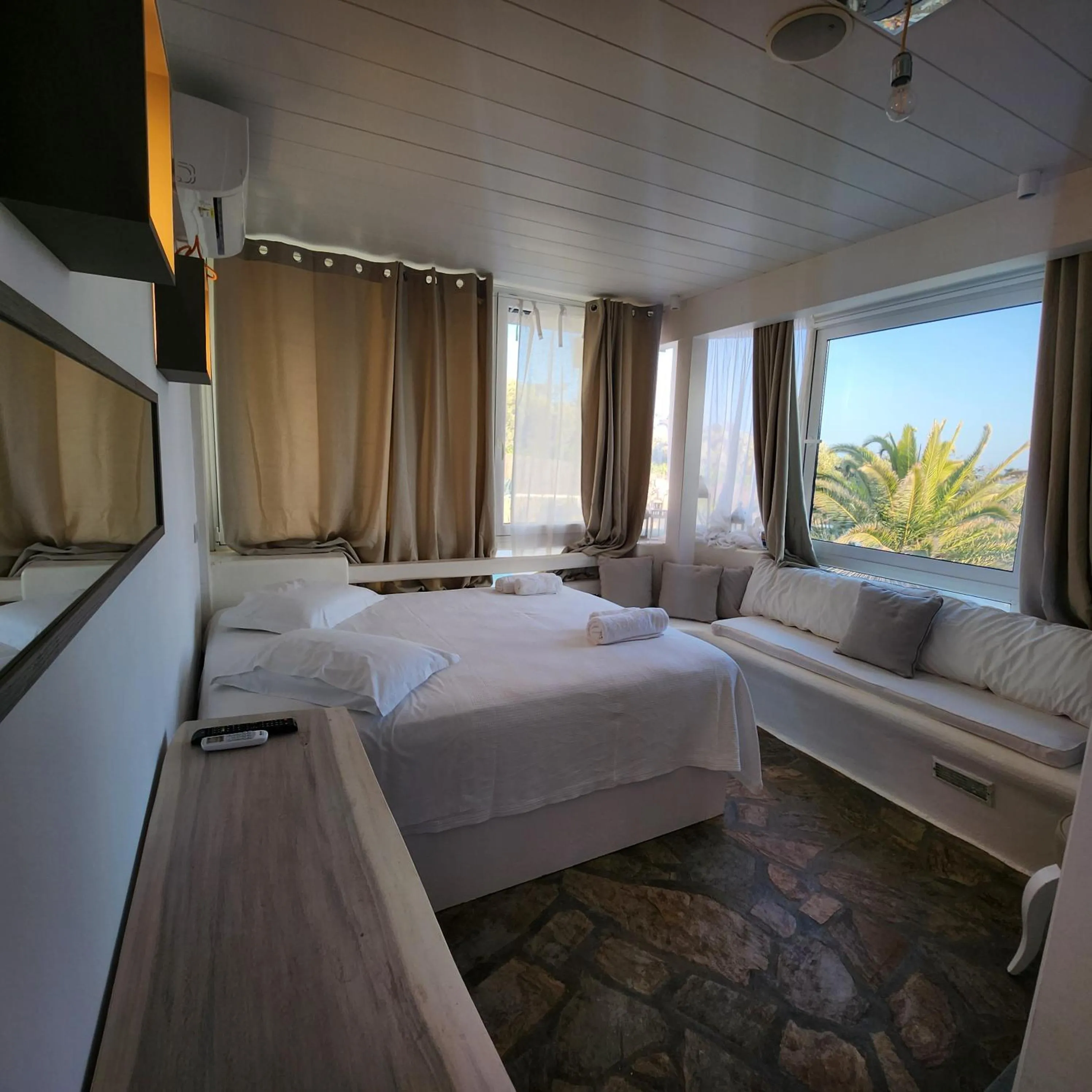 Bed in Mykonian Iros Suites & Villas