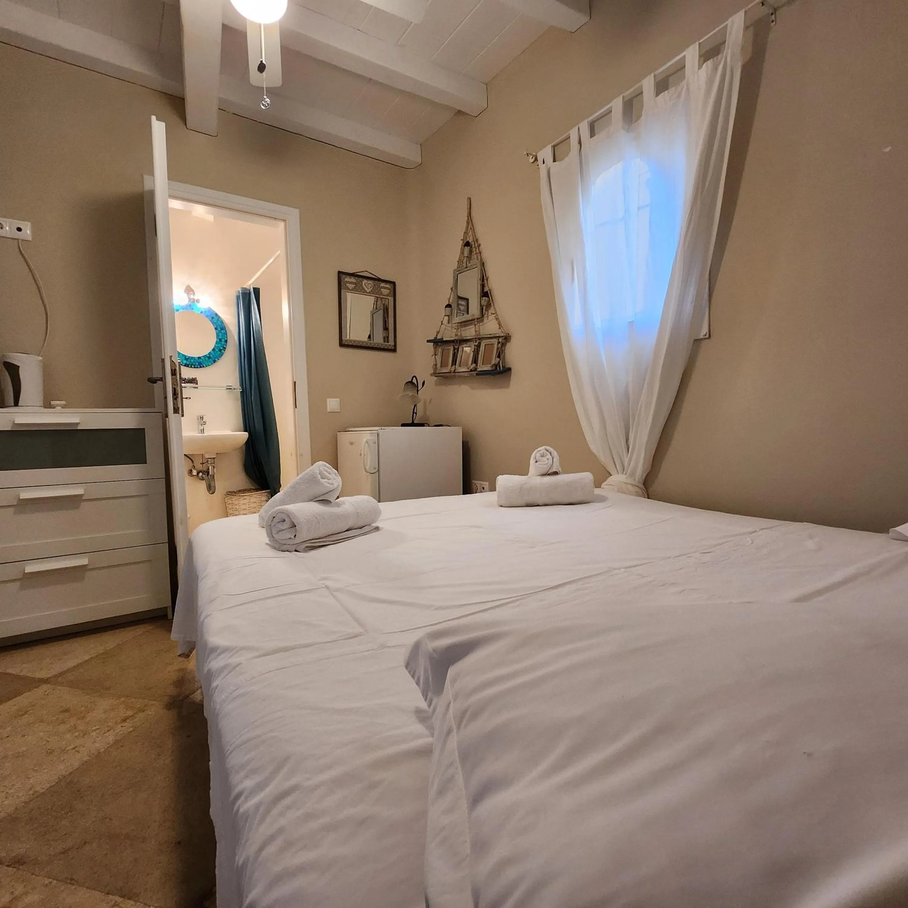 Bed in Mykonian Iros Suites & Villas