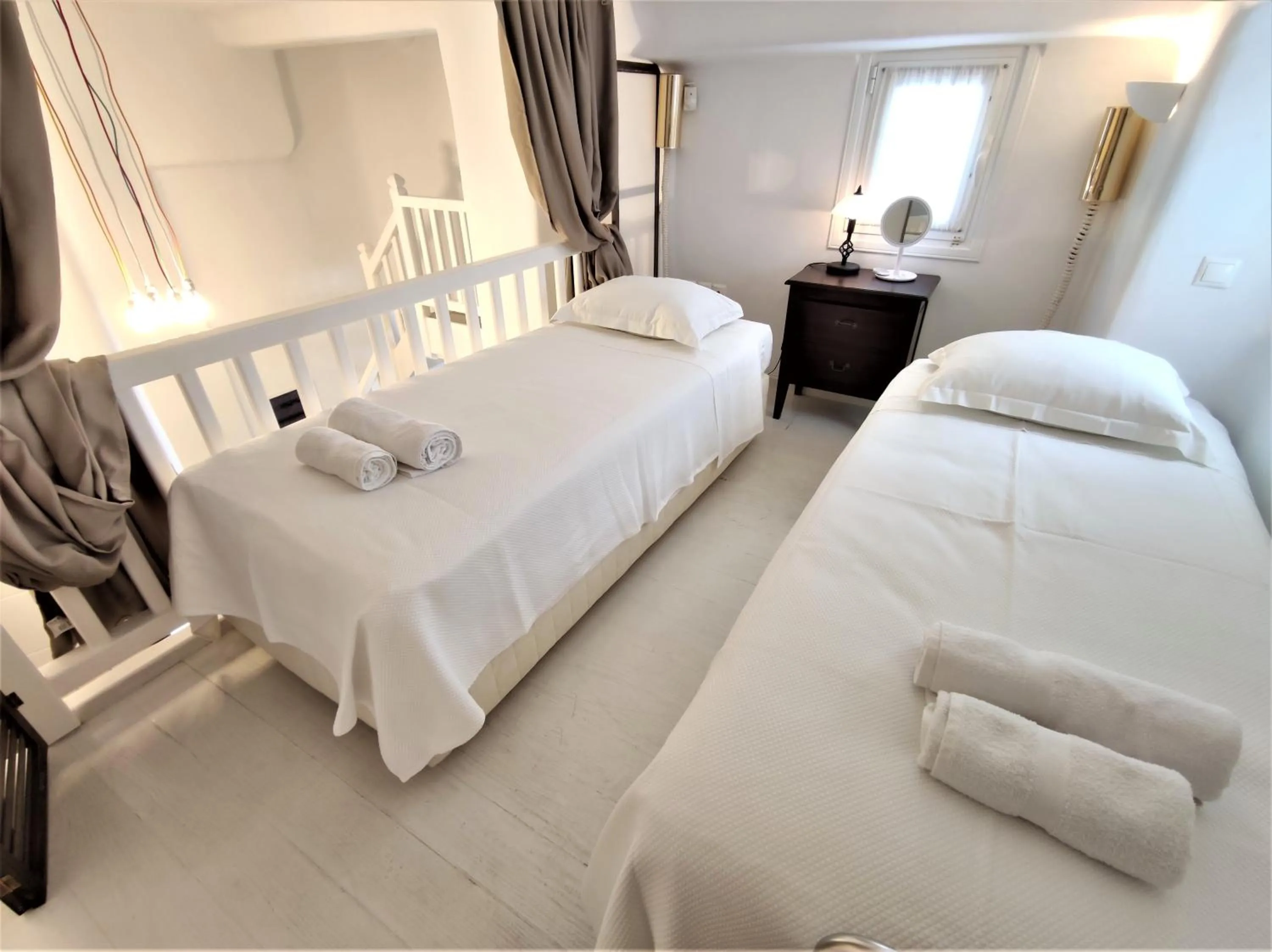 Bed in Mykonian Iros Suites & Villas