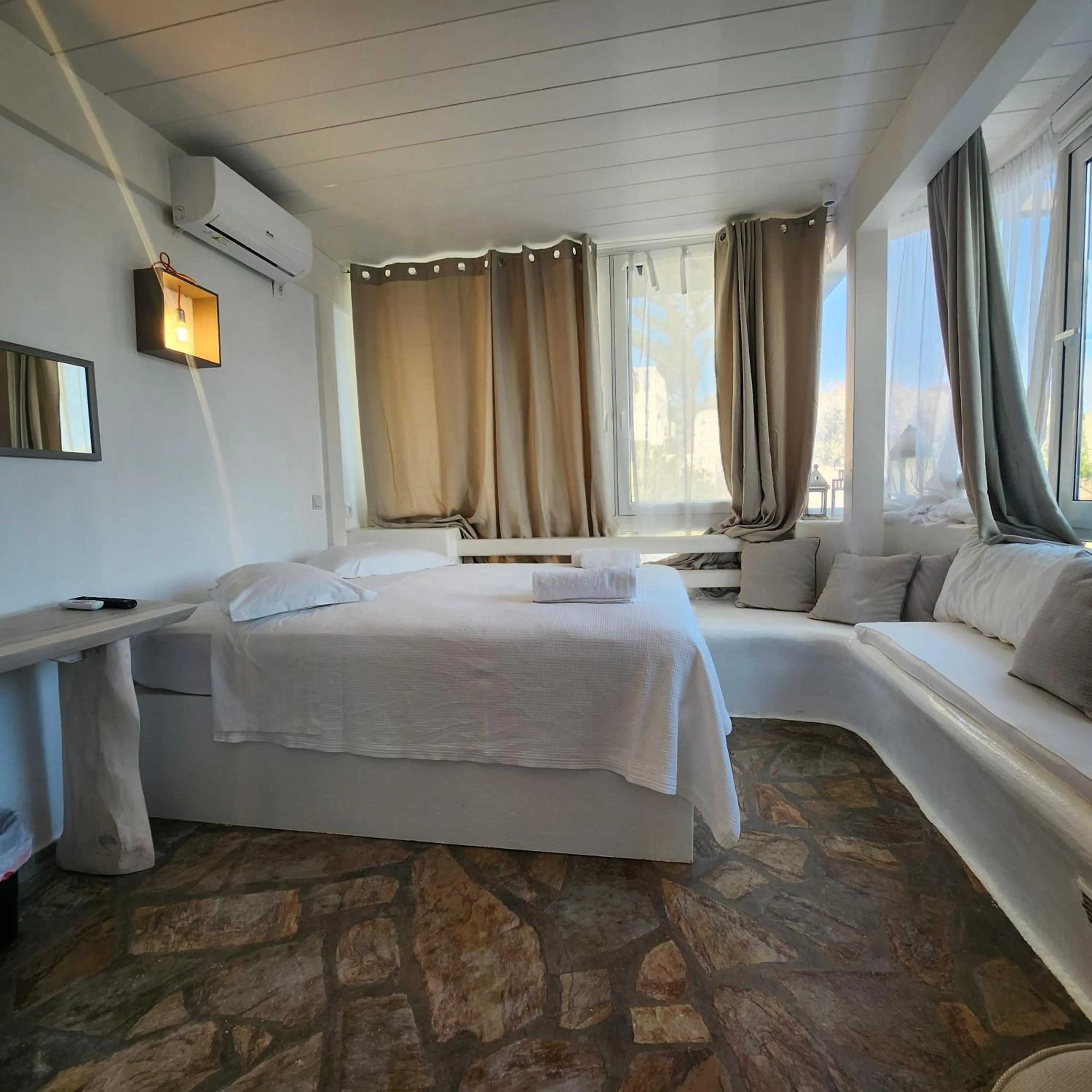 Bed in Mykonian Iros Suites & Villas