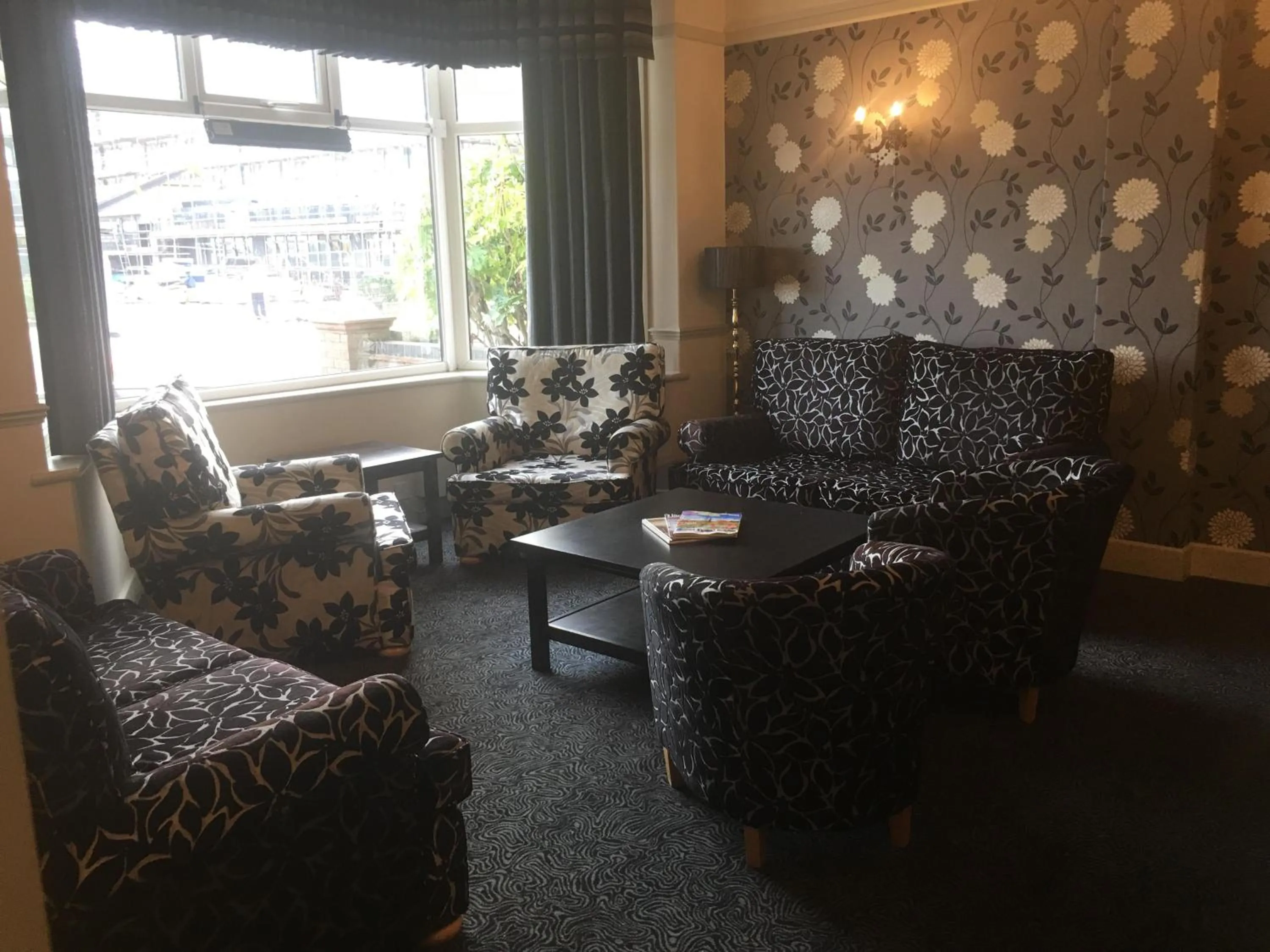 Communal lounge/ TV room in The Savoy