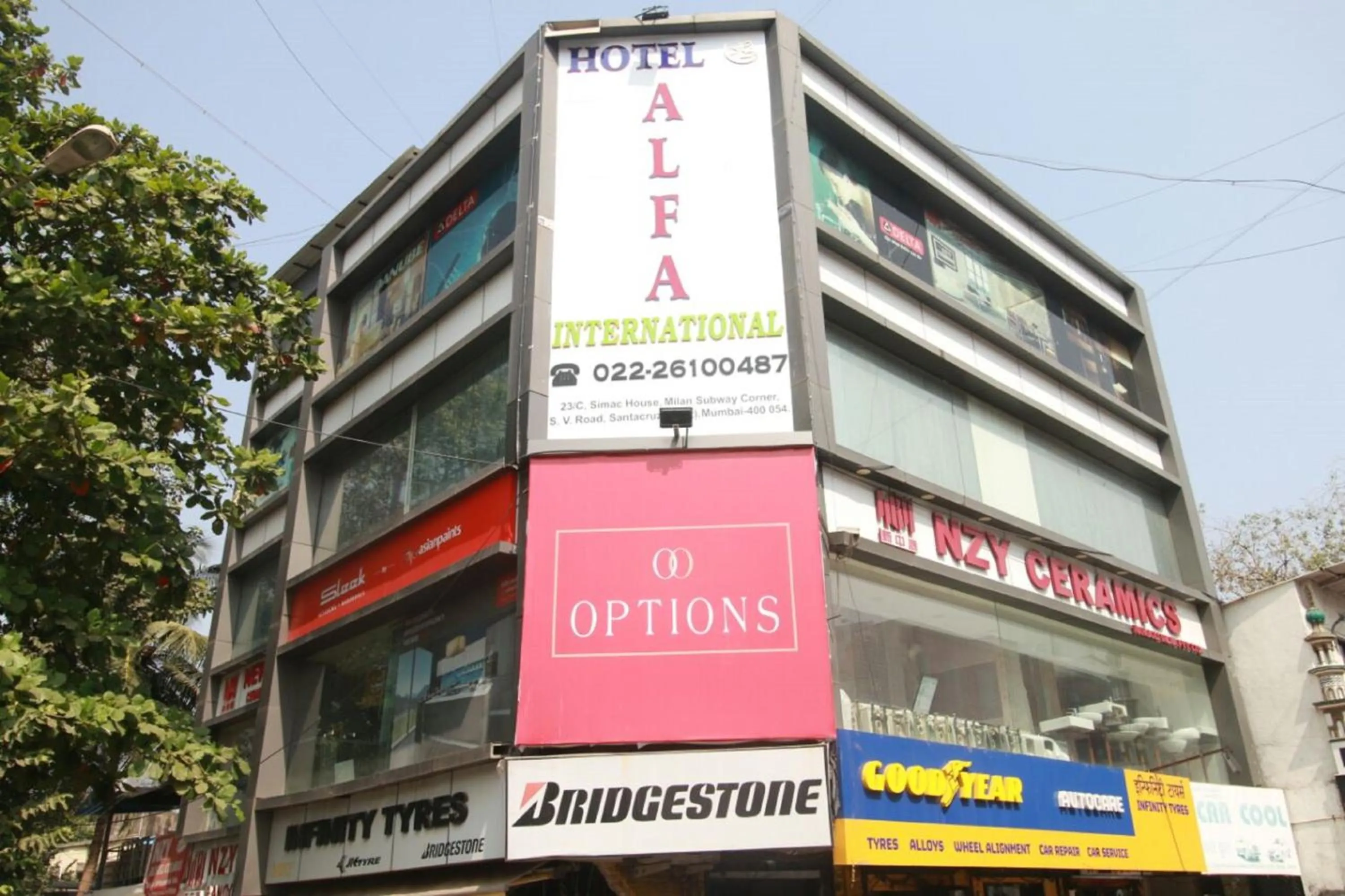 Property building in Hotel Alfa International Near Nanavati Hospital Mumbai Near Airport Mumbai Near Juhu Beach