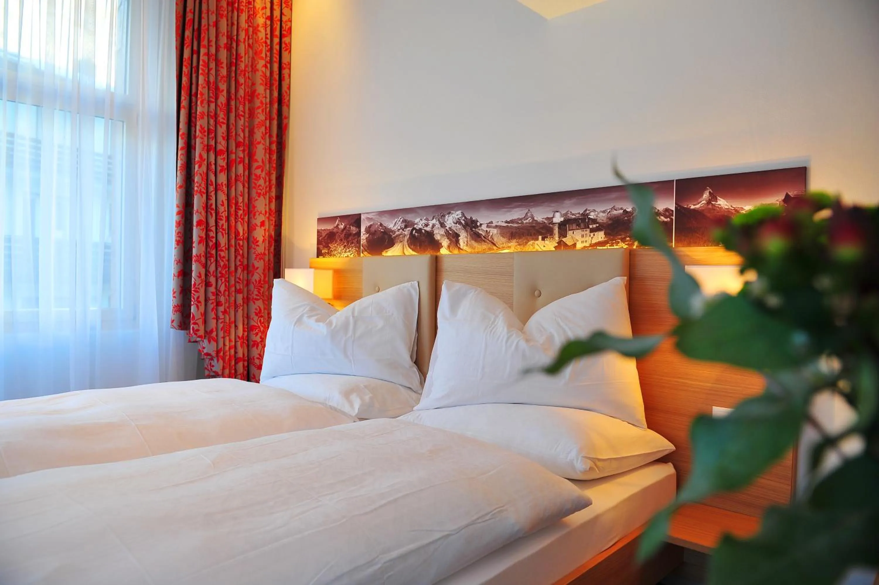 Bed in Hotel Aristella Swissflair