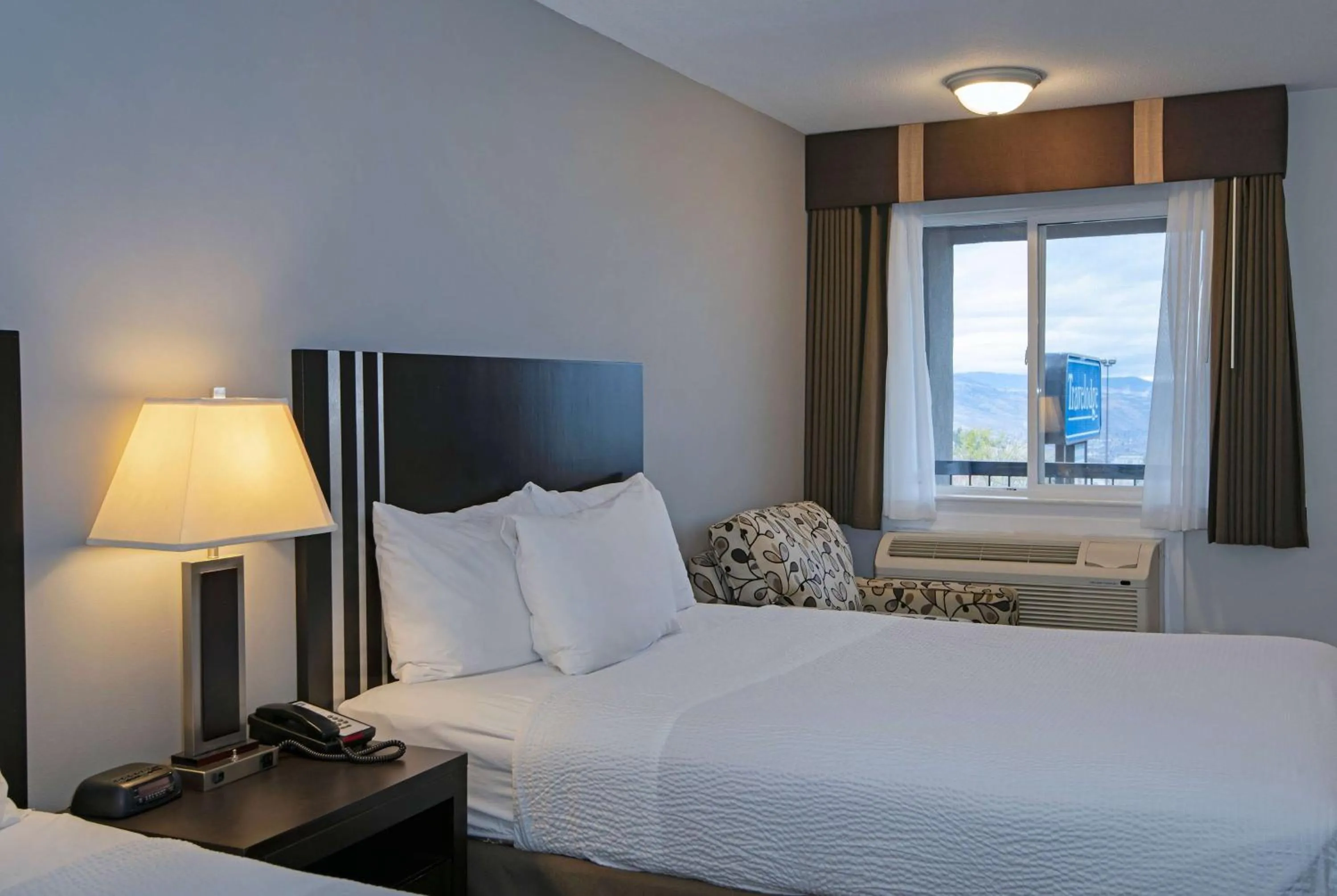 Photo of the whole room, Bed in Travelodge by Wyndham Kamloops Mountview