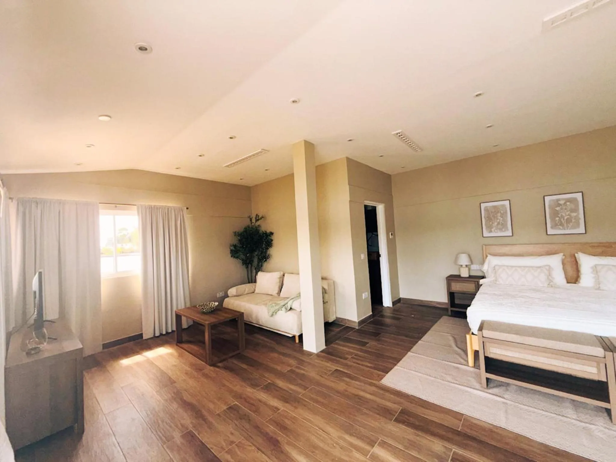 Living room, Bed in Secret Harbour Boutique Hotel and Marina