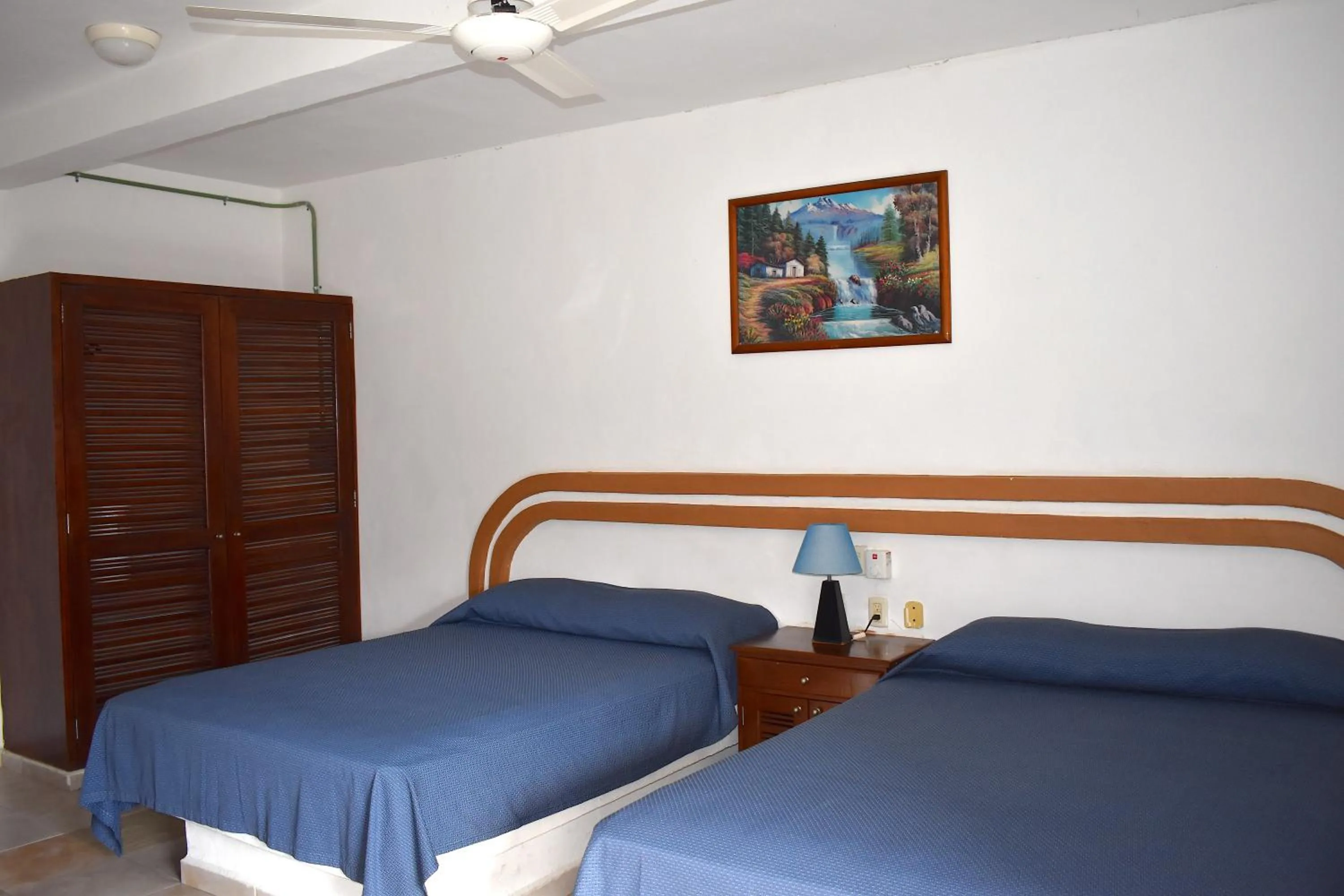 Bed in Plaza Almendros Hotel Isla Mujeres