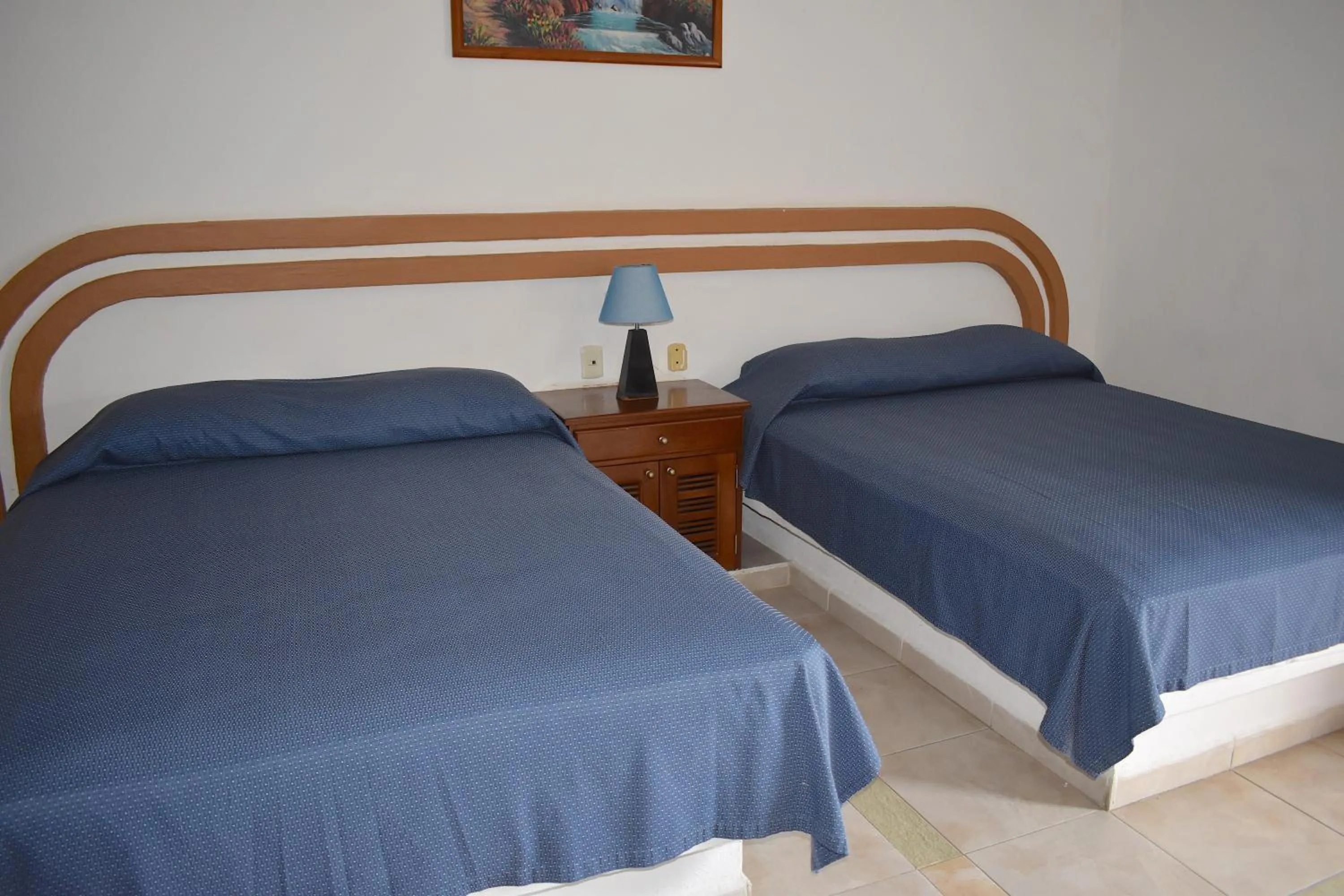 Bed in Plaza Almendros Hotel Isla Mujeres