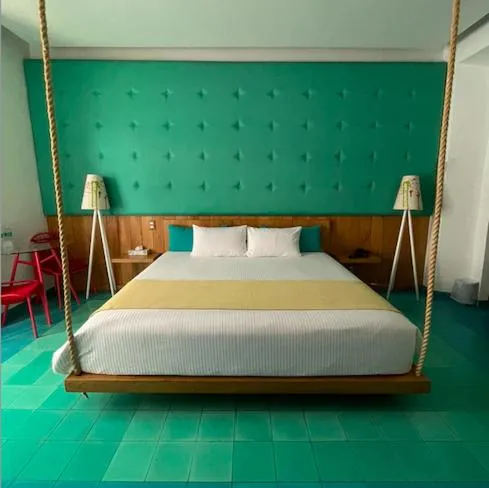 Bed in Del Carmen Concept Hotel Boutique by Chai