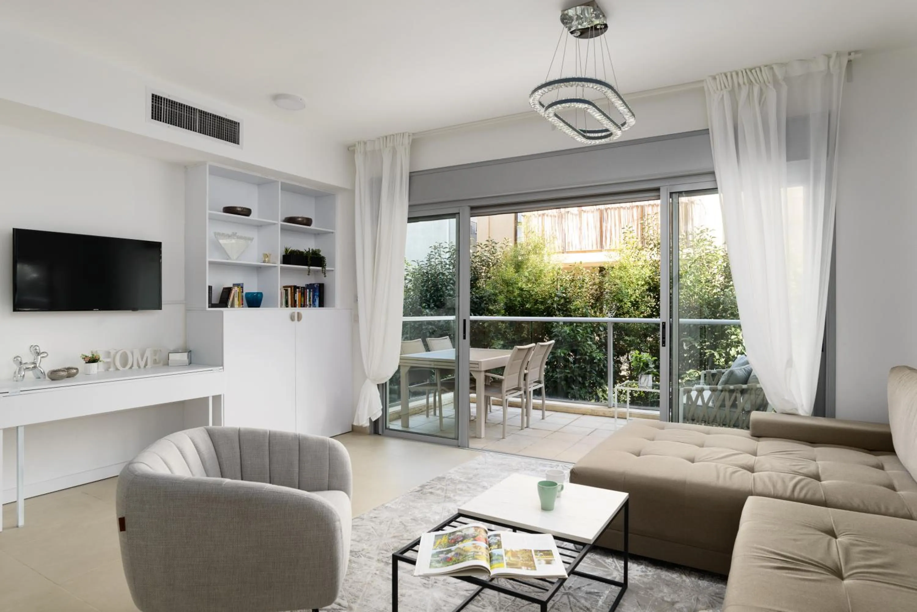 Living room in Quiet Hideaway & Terrace near Beach by FeelHome