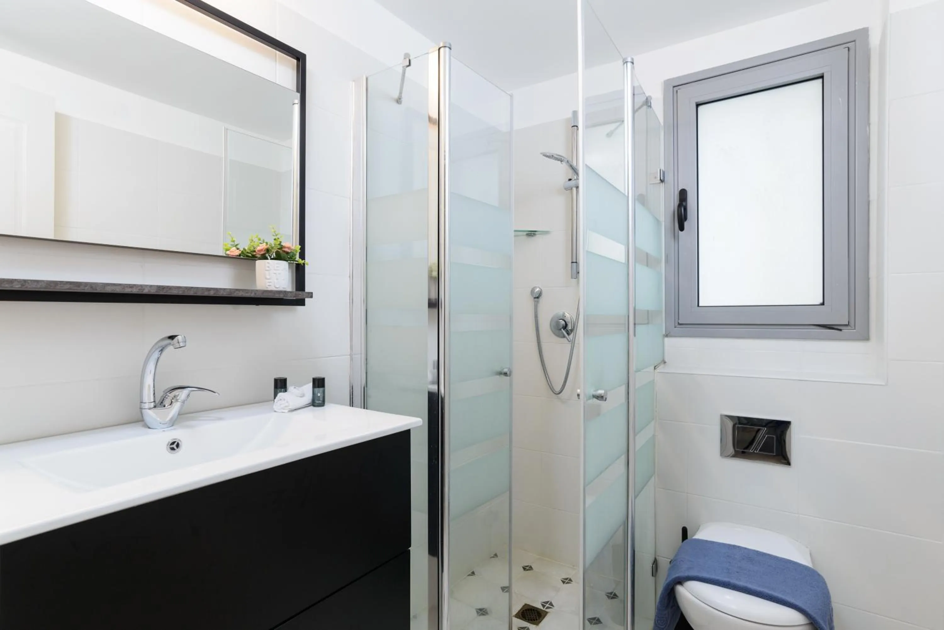 Bathroom in Quiet Hideaway & Terrace near Beach by FeelHome