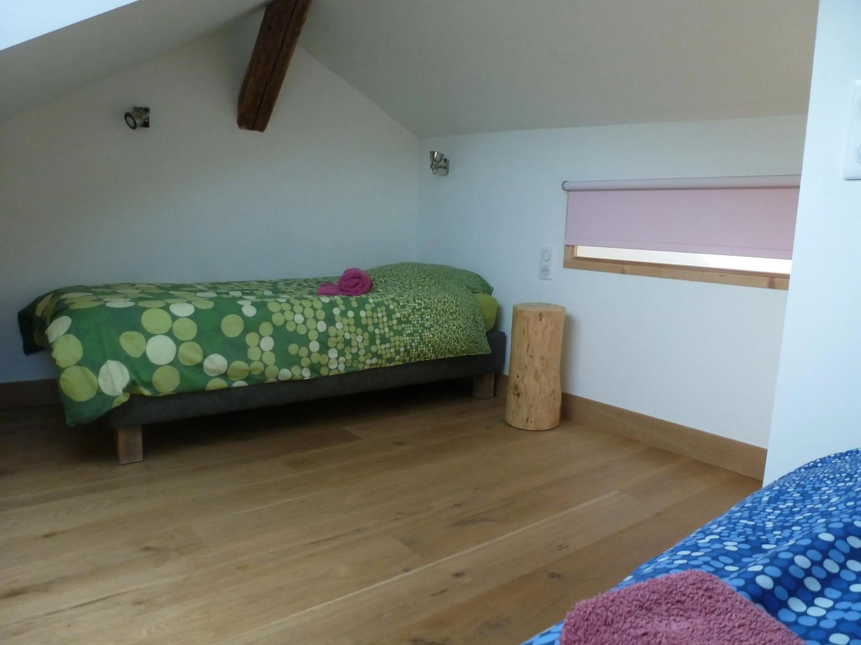 Bed in Au Cheval Blanc - appartements et chambres d'hôtes