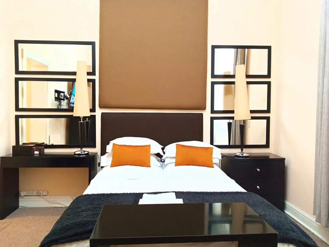 Bed in Liberty Lodge Guest House