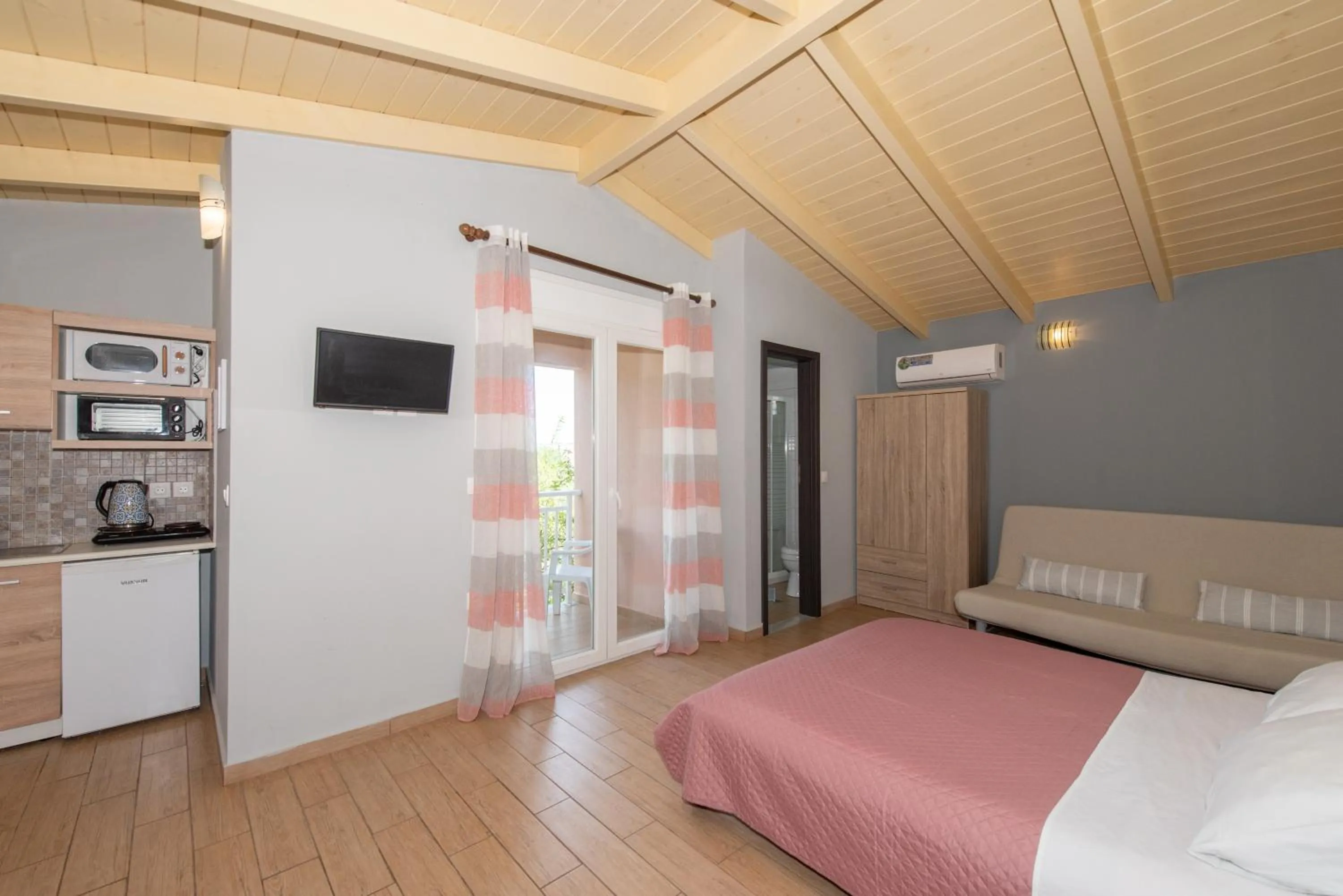 Bed in Tsolakis Studios & Apartments