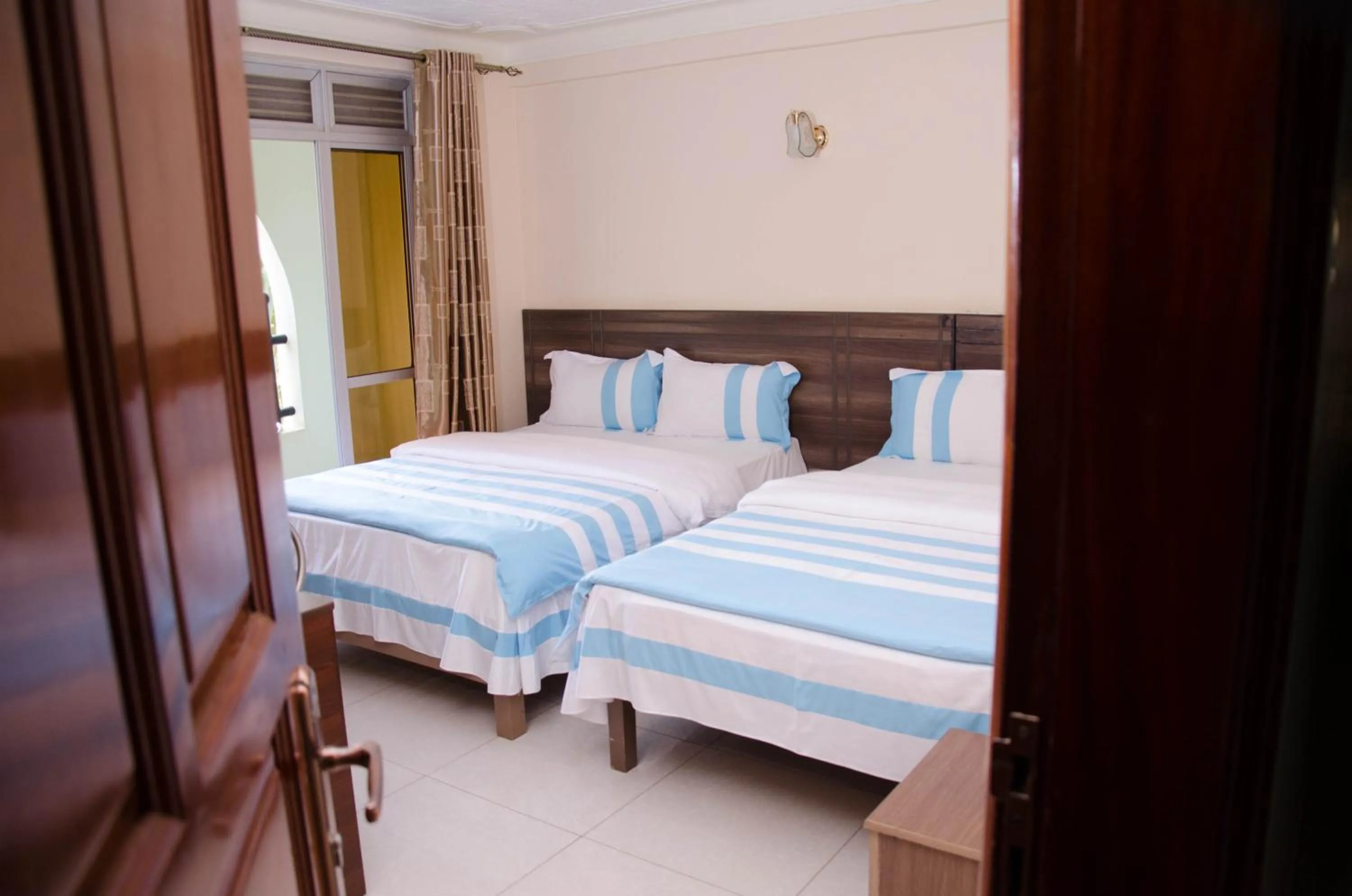 Bed in Agenda 2000 Hotels Ltd