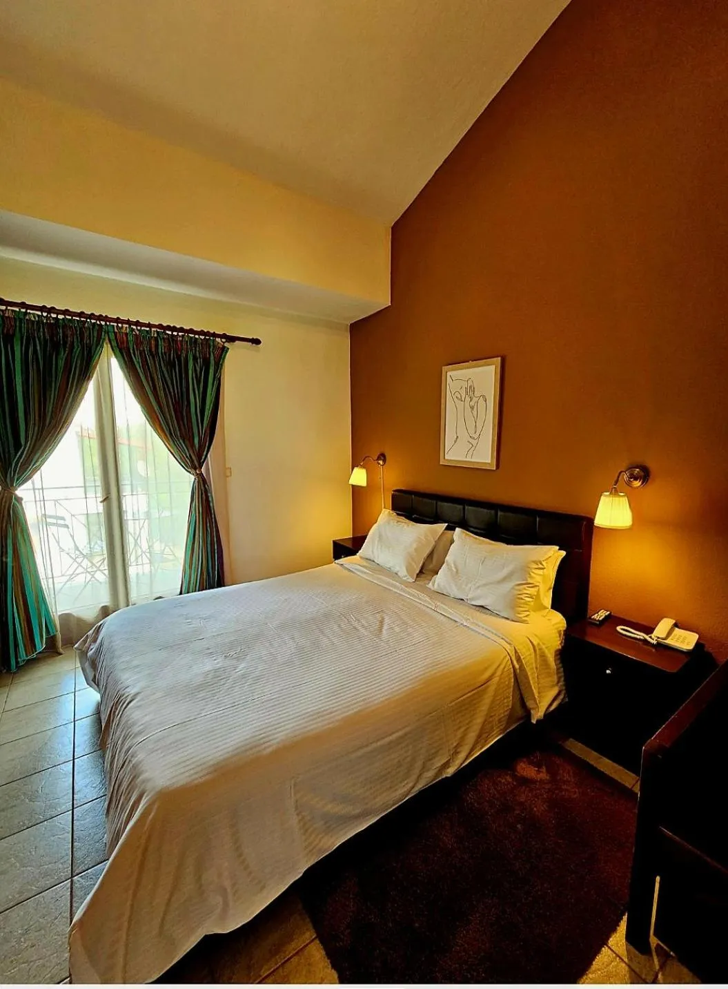 Bed in Hotel Odysseas