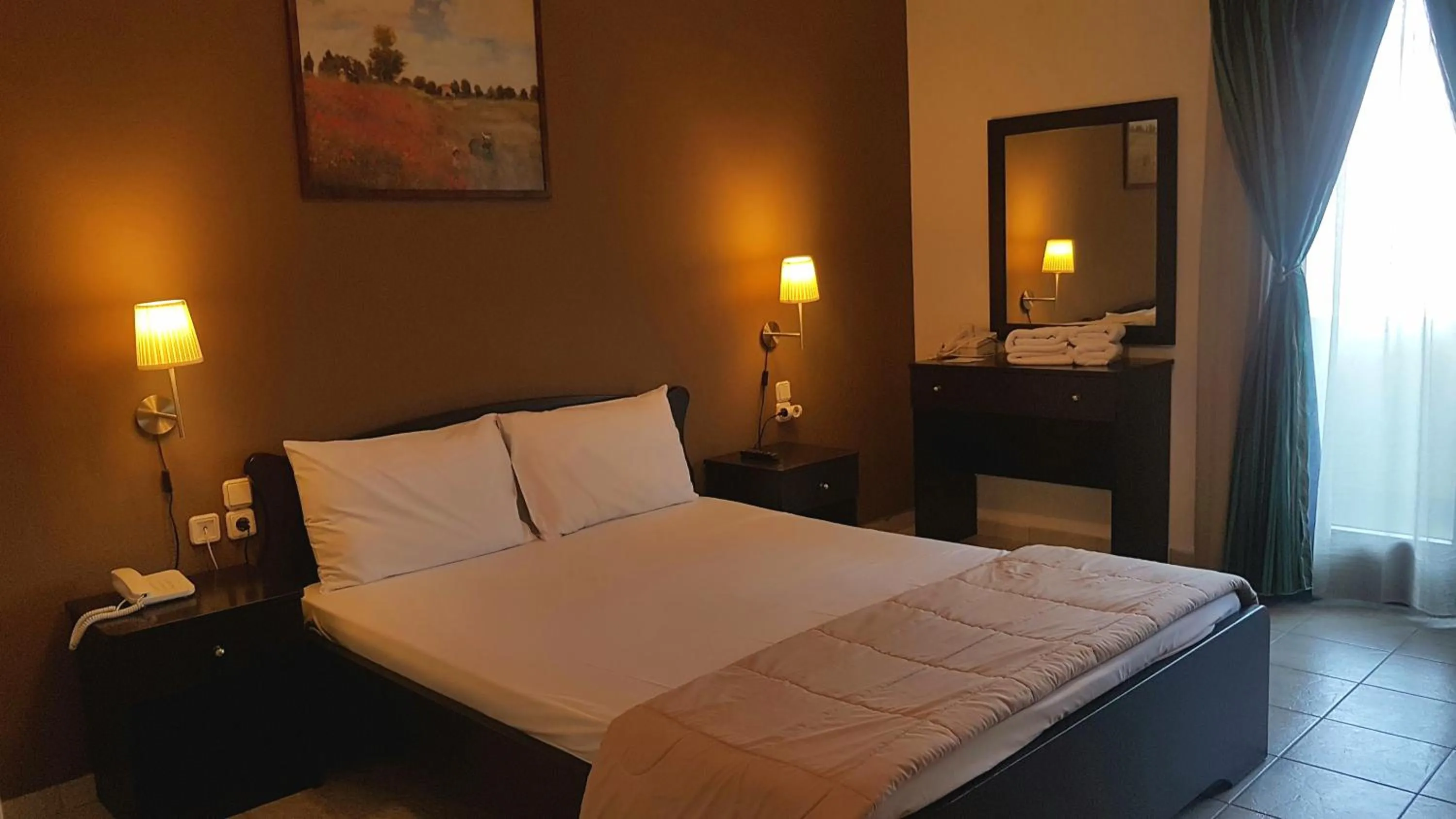 Bed in Hotel Odysseas