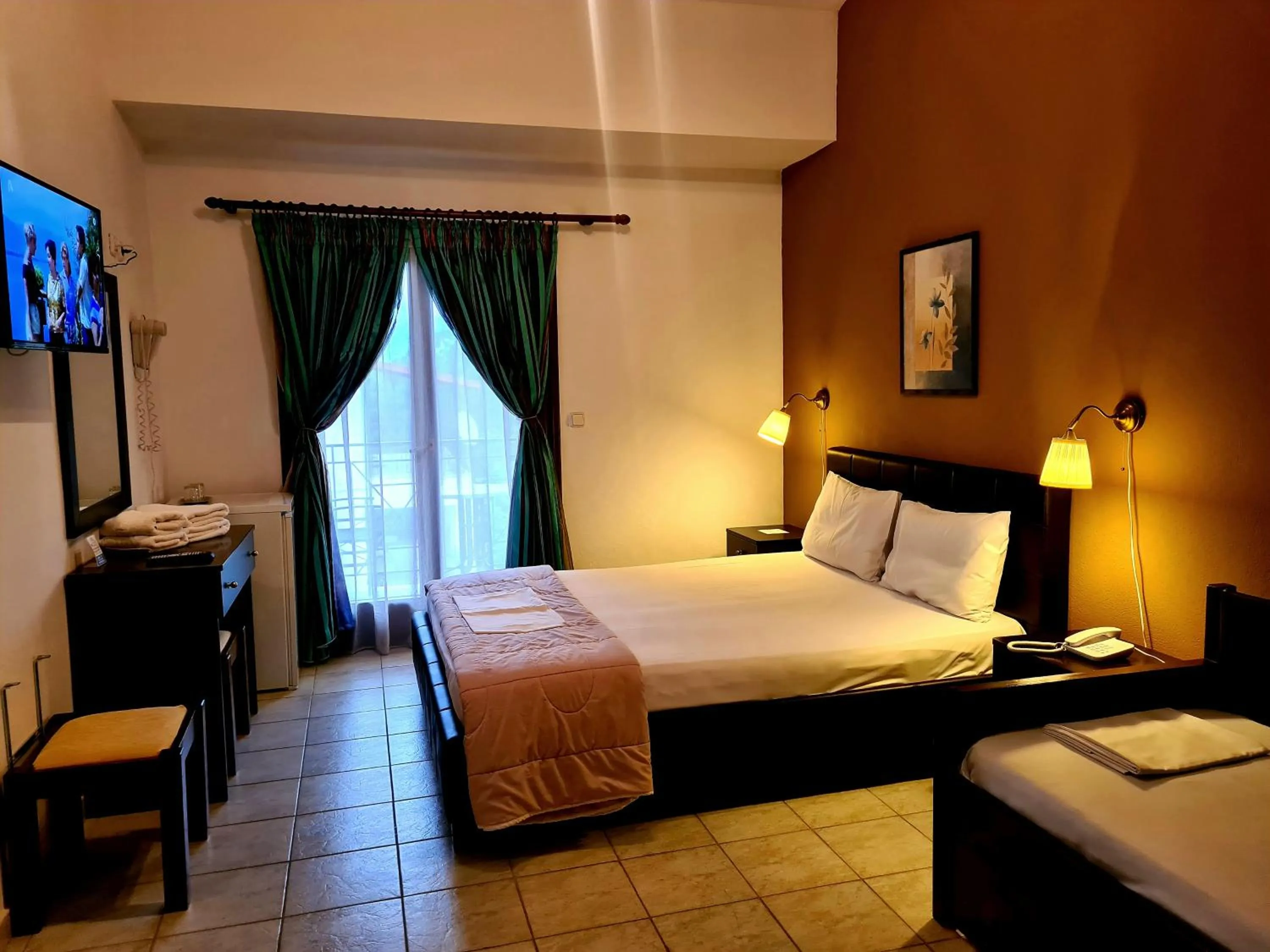 Bed in Hotel Odysseas